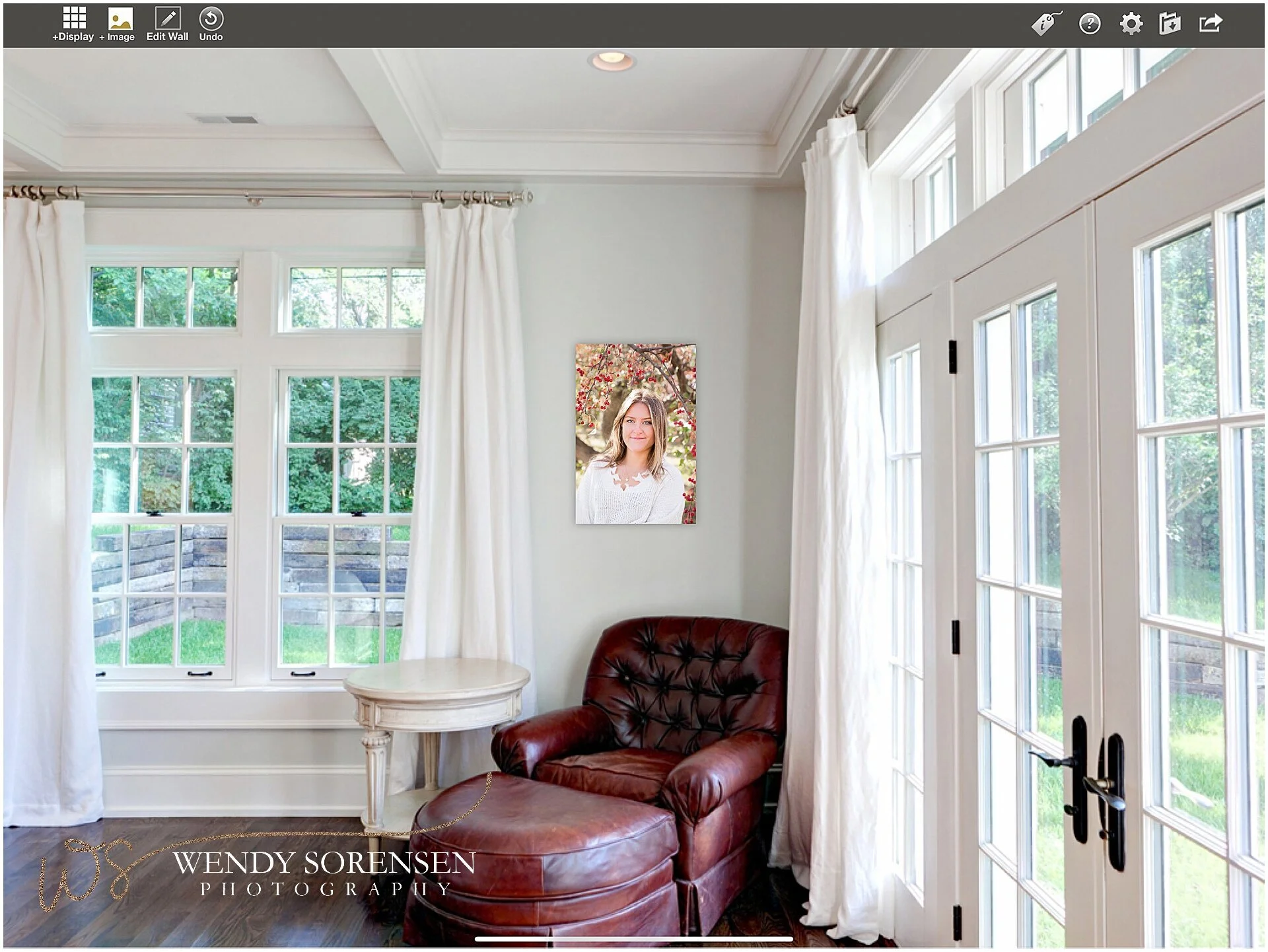 Mock up of a canvas gallery wrapped print above a leather chair.