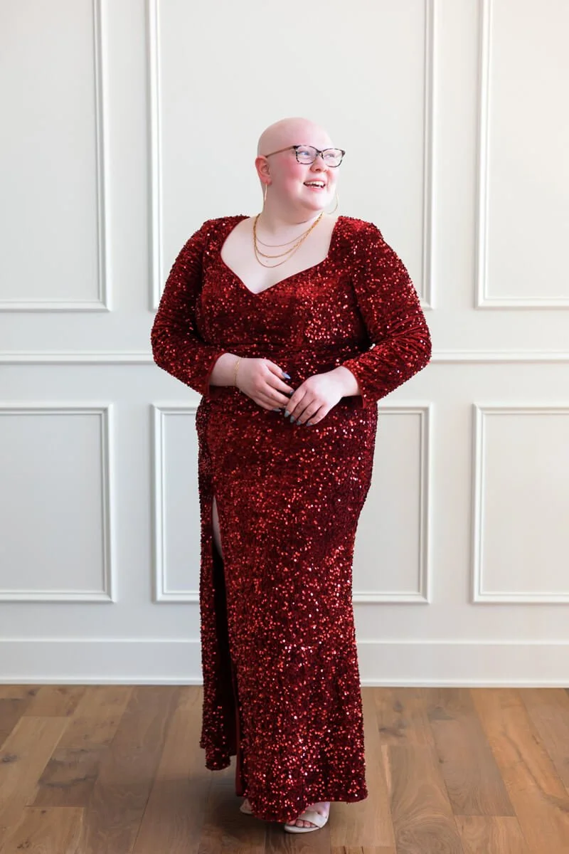 High school senior girl wearing long red sequin prom gown in Des Moines.