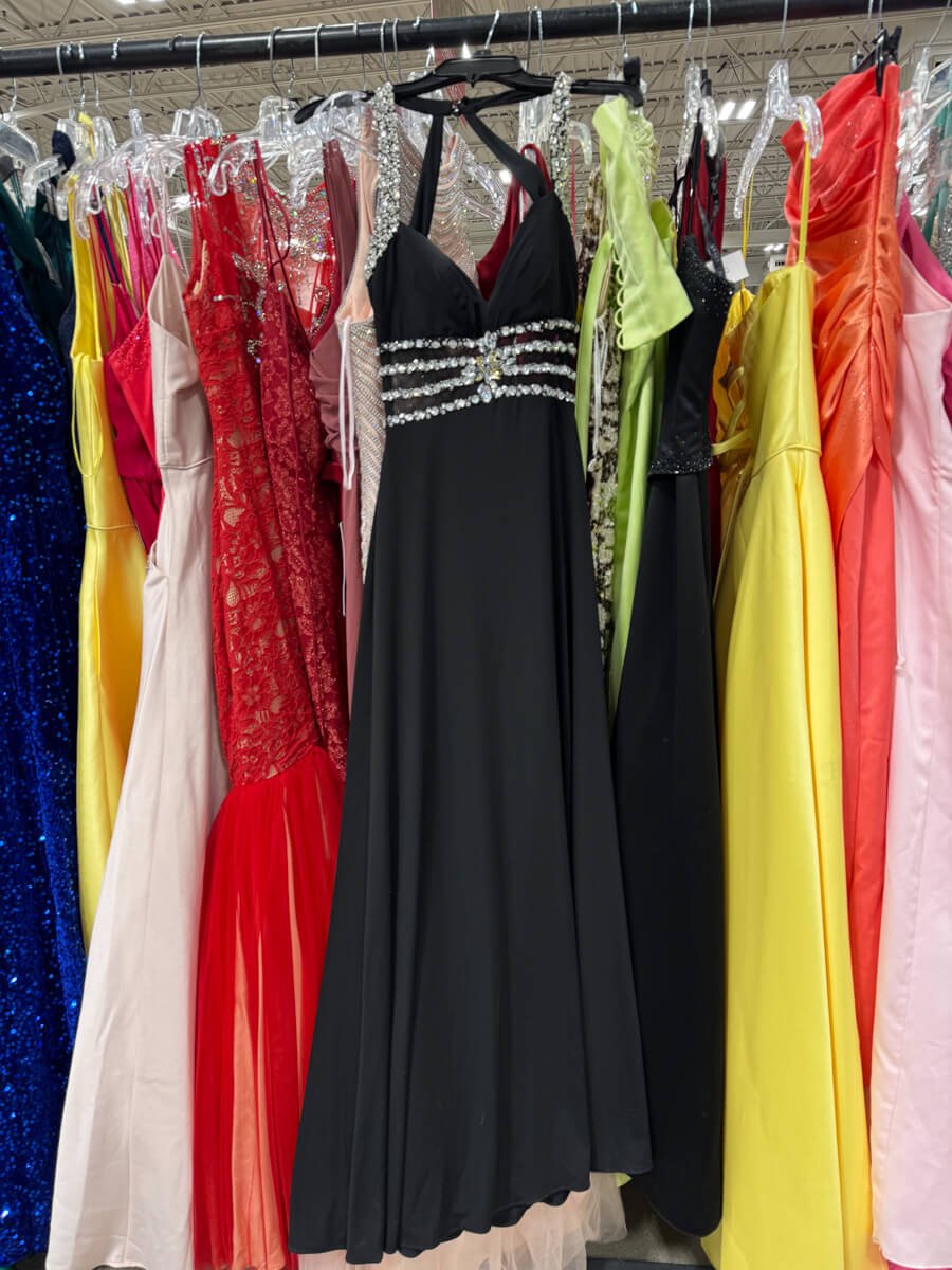 Rack of second hand prom dresses at Many Hands Thrift Market in Clive, Iowa.
