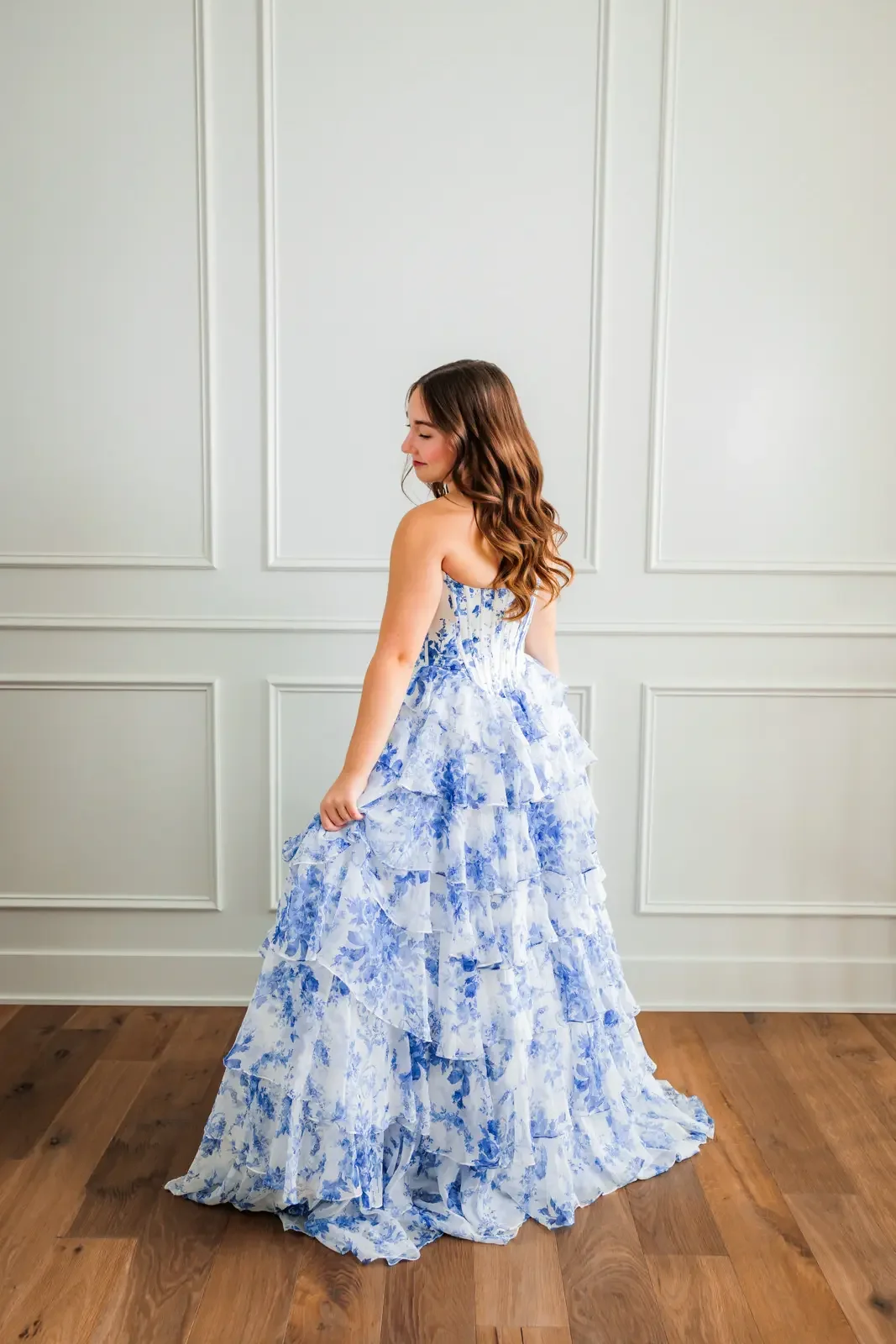 Back detail of blue and white floor length prom dress in Des Moines.