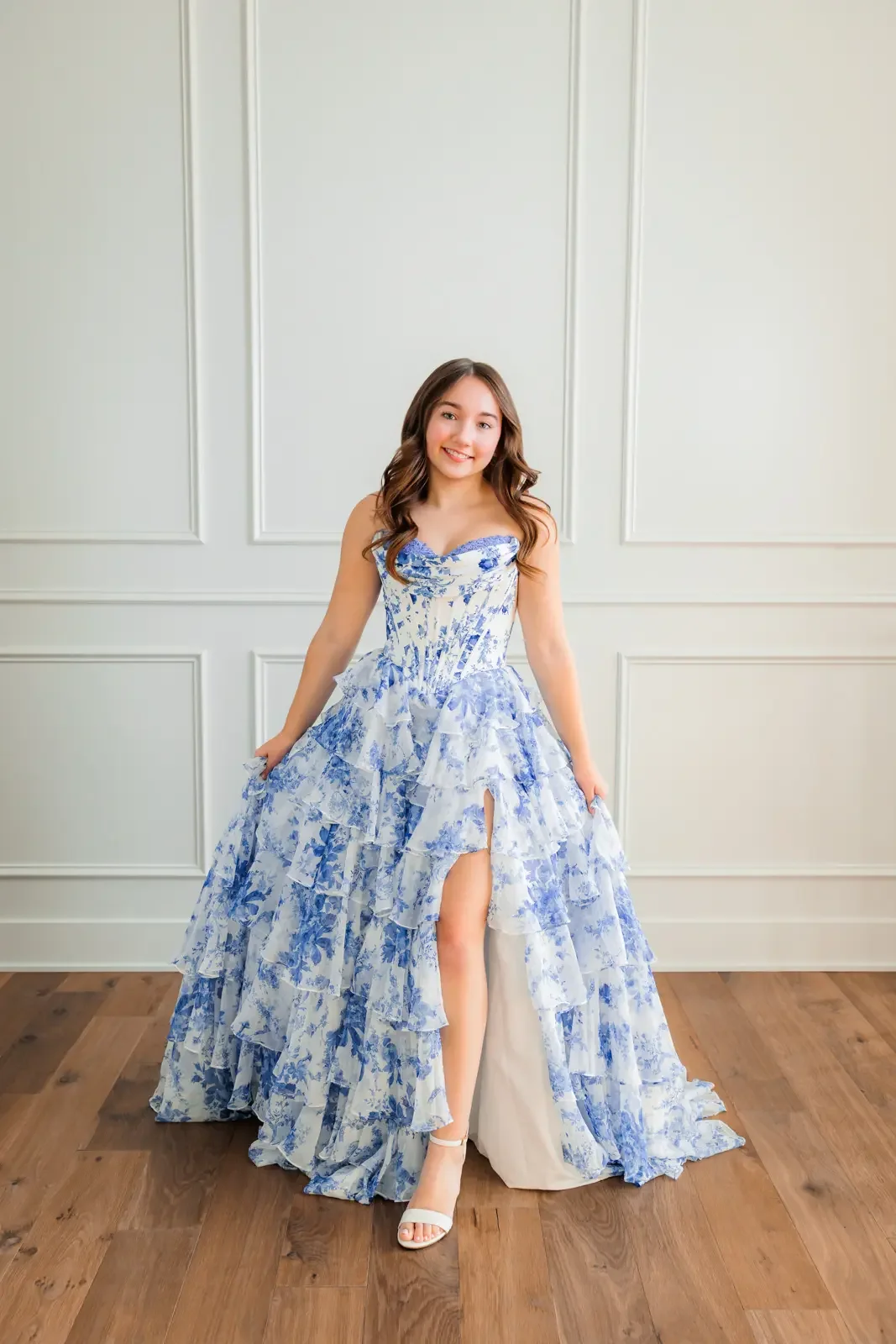 Senior girl wearing a blue and white floor length prom dress.  Photo by Wendy Sorensen, a Des Moines senior photographer.
