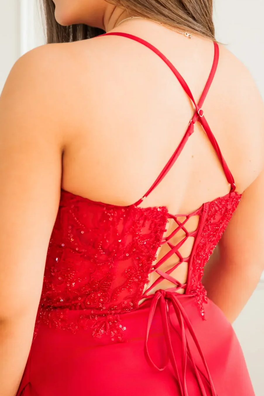 Close up of prom dress back detail, featuring a corset style.