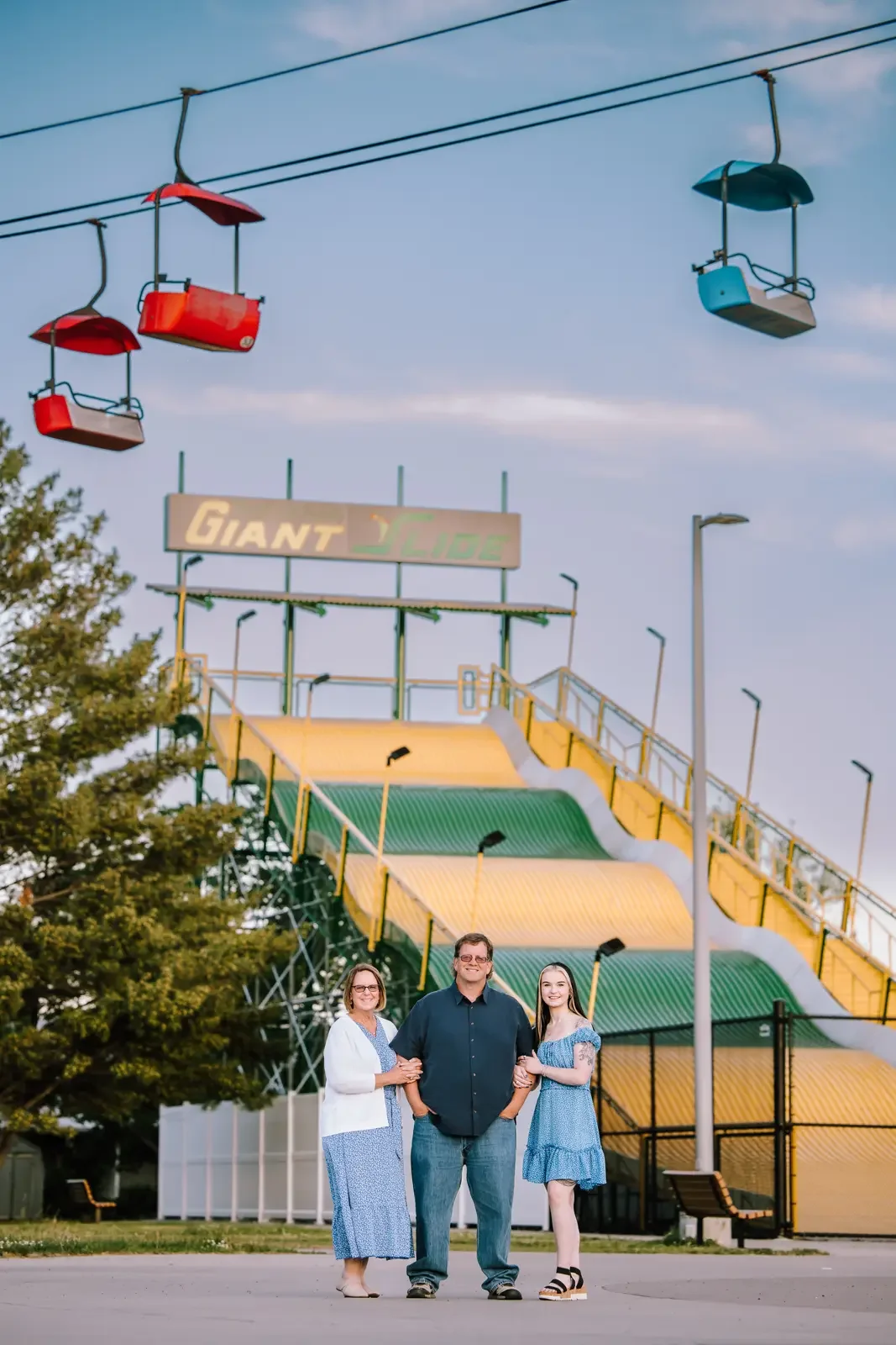 Family standing in front of the giant slide at the Iowa State Fairgrounds.