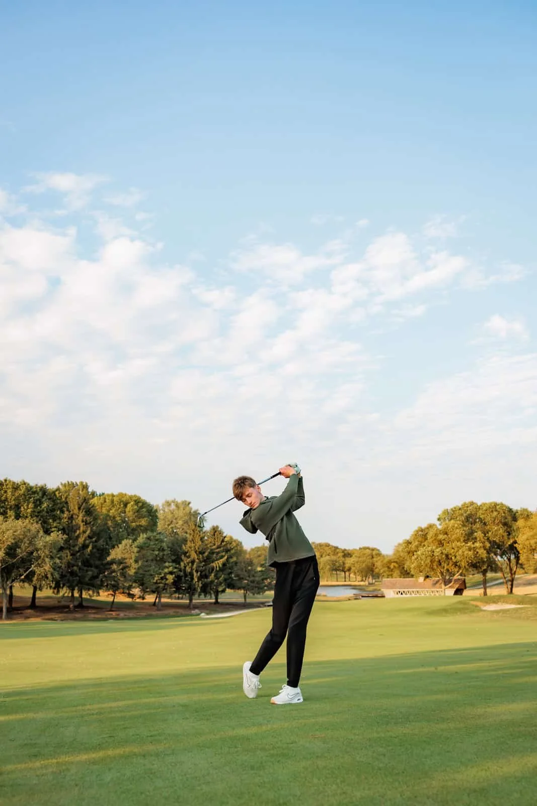 Senior boy playing golf in Des Moines, iowa.
