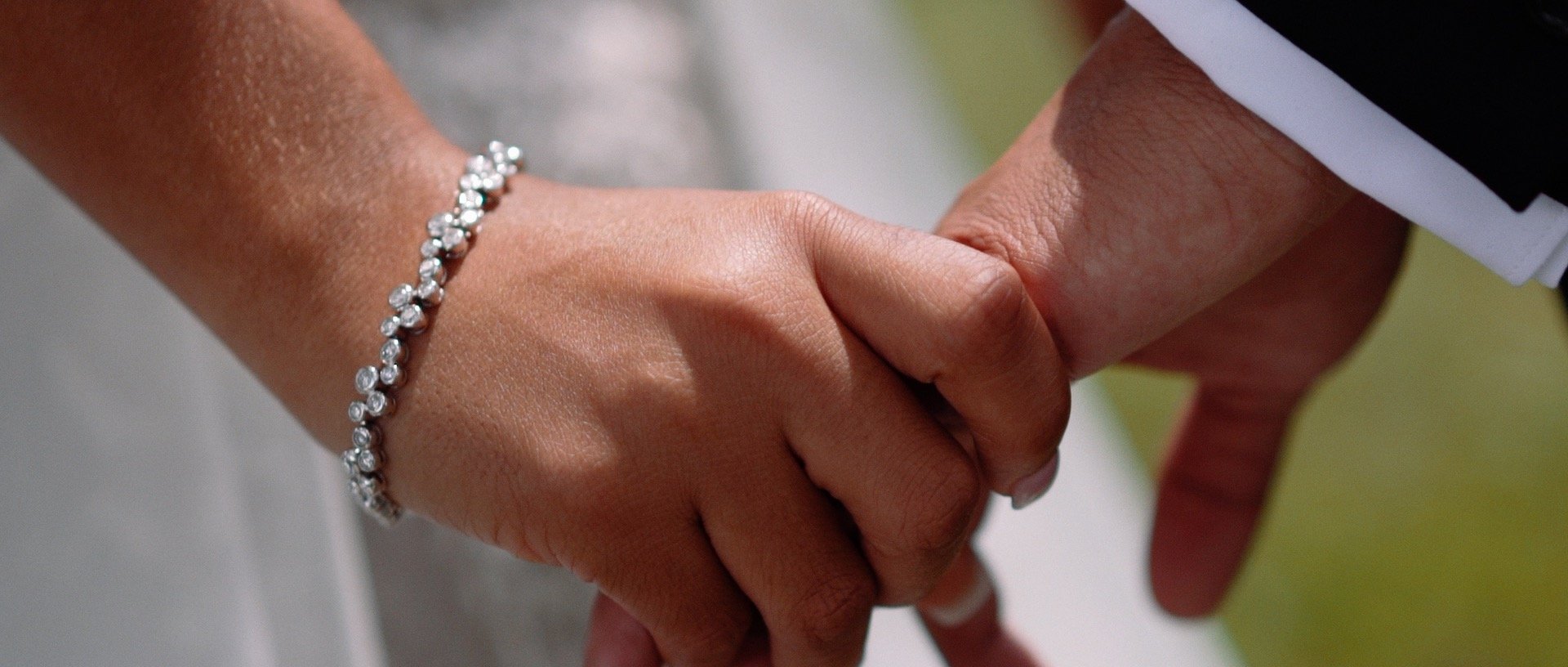 cincinnati wedding videographer - Bride and groom holding hands