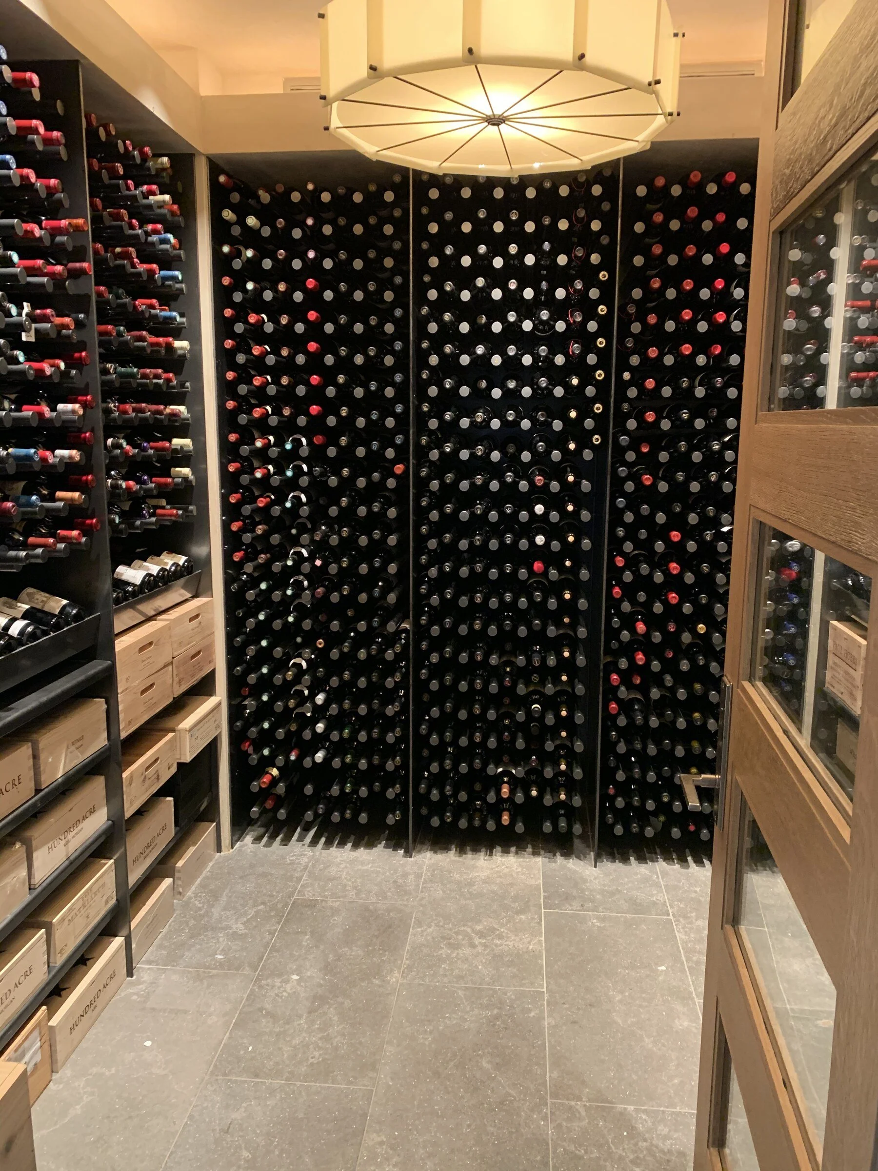 Precisely organized modern private wine cellar