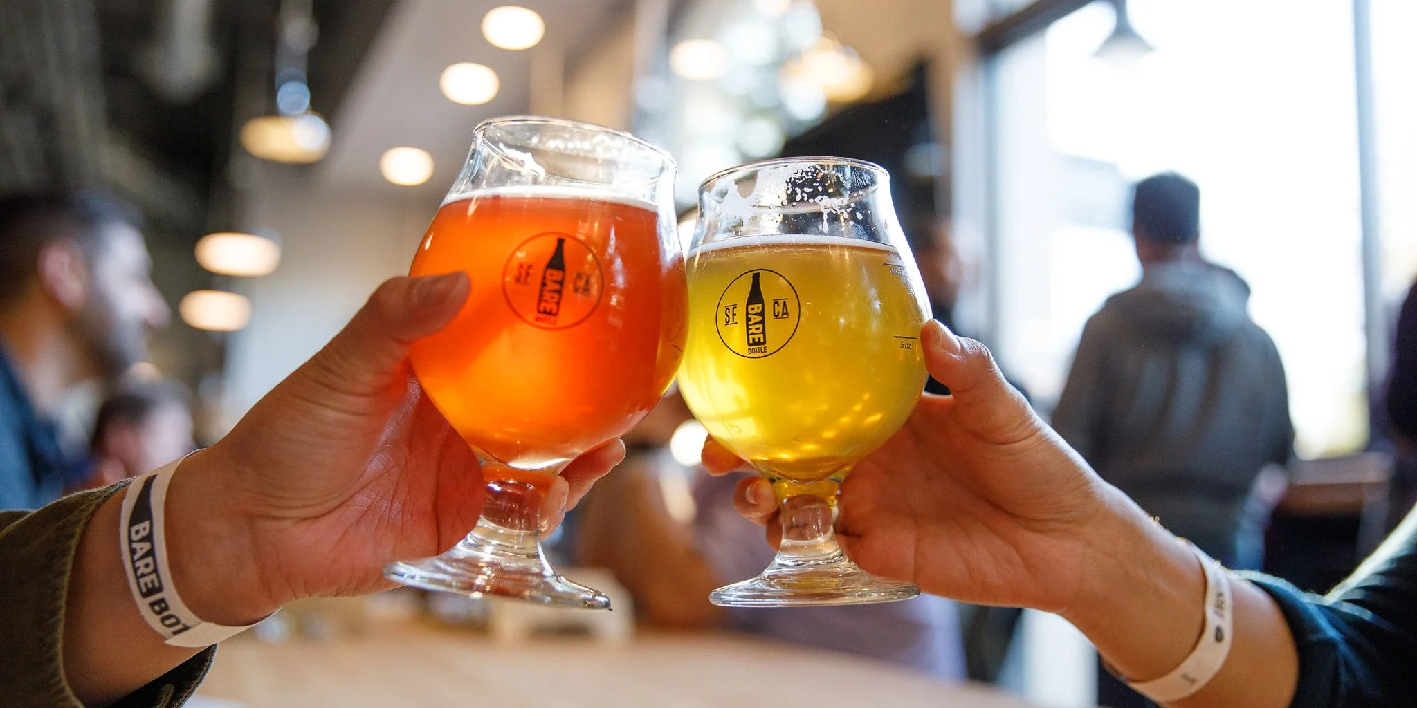 Two glasses being clinked together