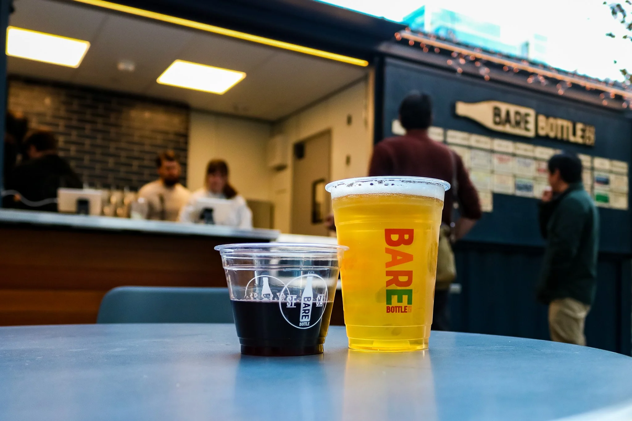 A cup of beer and a cup of wine