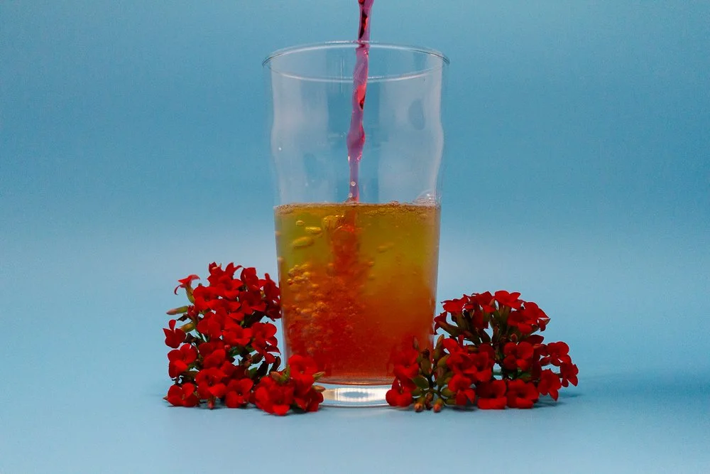 Koga Kola being poured into a glass.