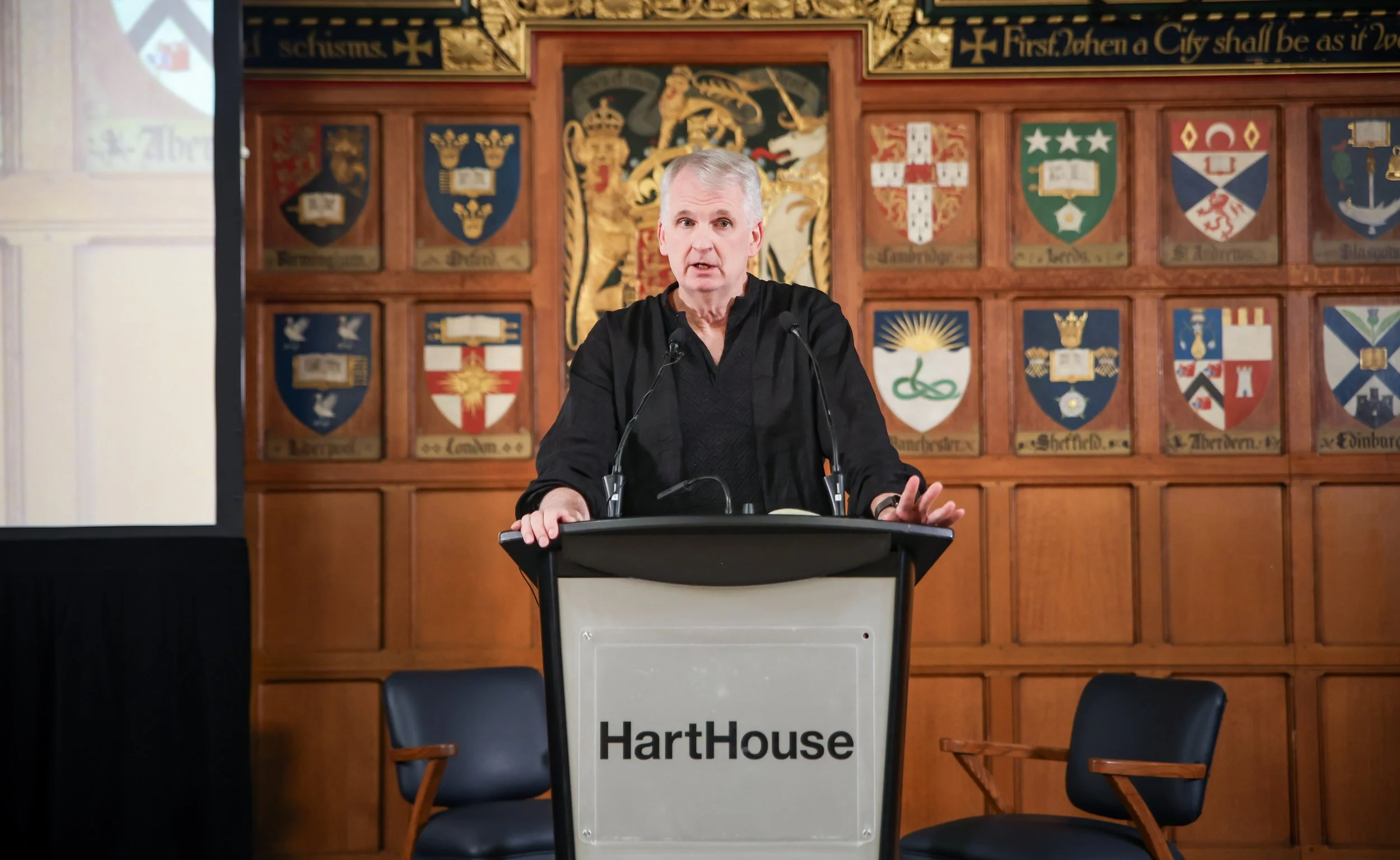 Dr. Timothy Snyder standing in front of a podium at Hart House, University of Toronto.