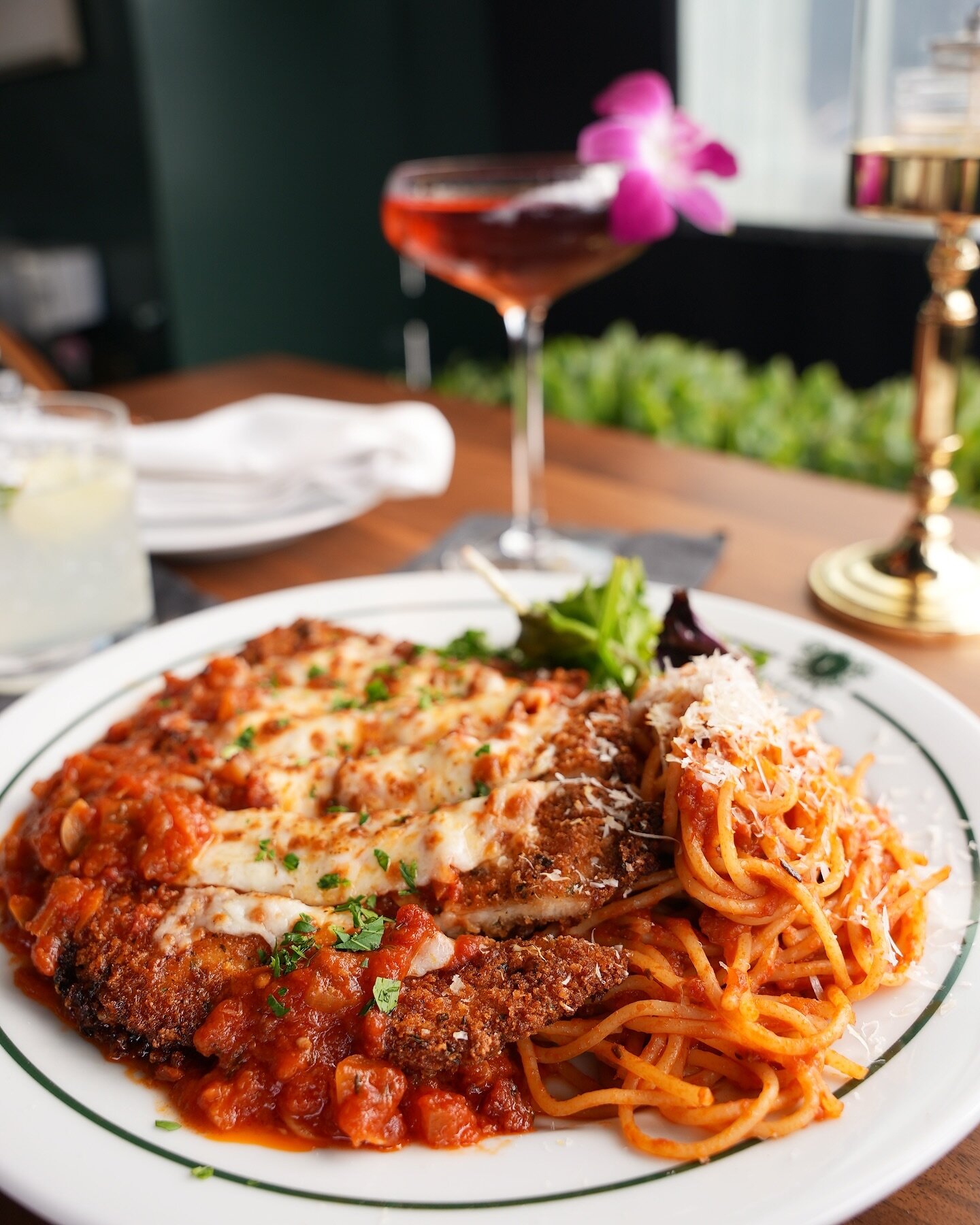 Classic Chicken Parmigiana: golden-breaded chicken meets melted mozzarella and zesty tomato with spaghetti. Italian comfort, redefined.

#losangeles #beverlyhills #westhollywood #ChickenParm #ItalianEats #delicious #classicmaderight