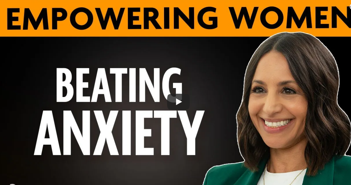Smiling woman with shoulder-length brown hair, wearing a green blazer, in a promotional image with the text 'Empowering Women' and 'Beating Anxiety' against a black background with an orange banner.