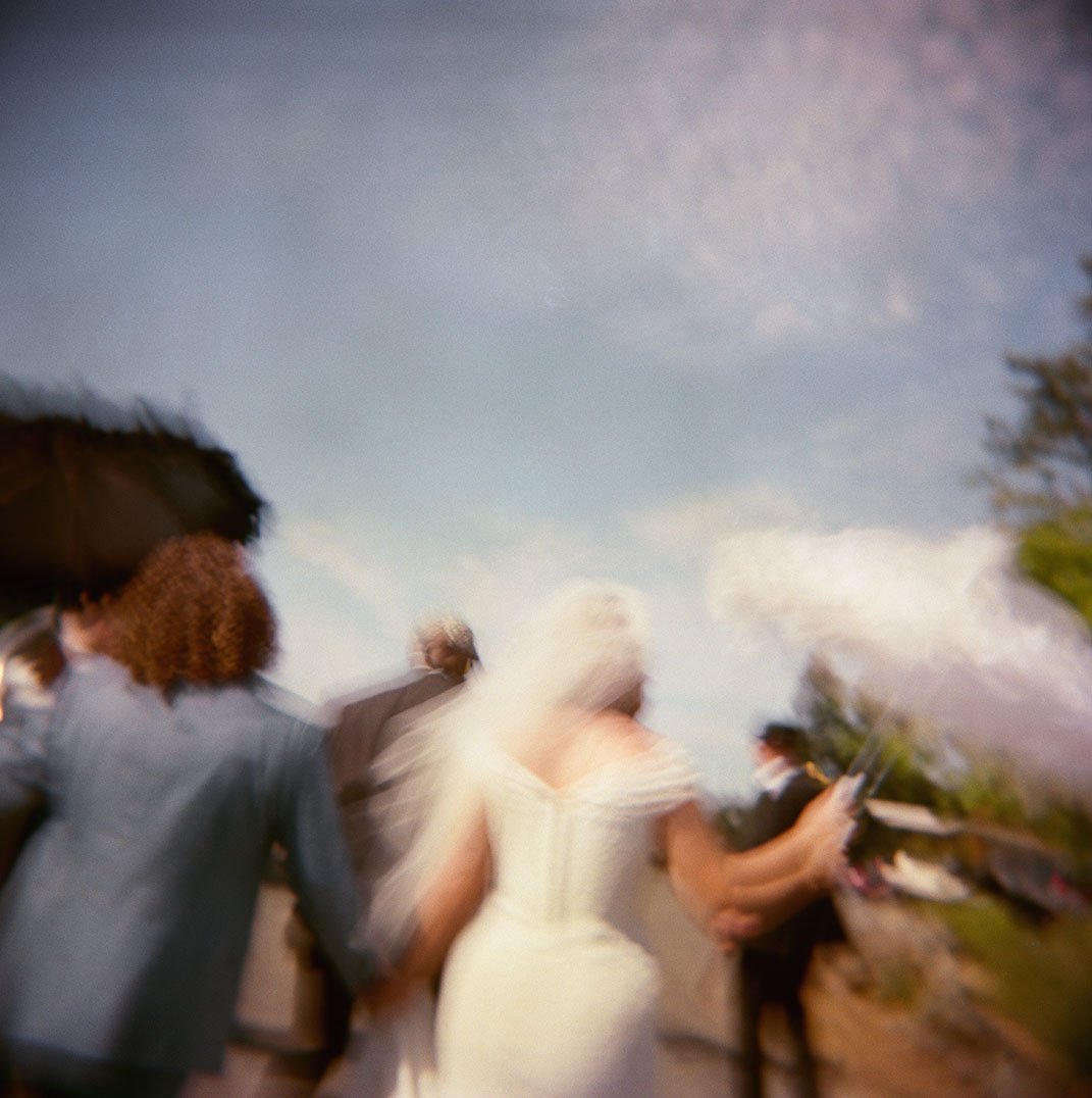 Artistic wedding at Arista Winery in spring. The photo is blurred and there is a vintage feel due to the photo being on film.