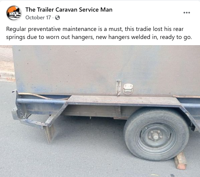Close-up of a tradesman's trailer with a missing wheel due to worn out rear springs and hangers.