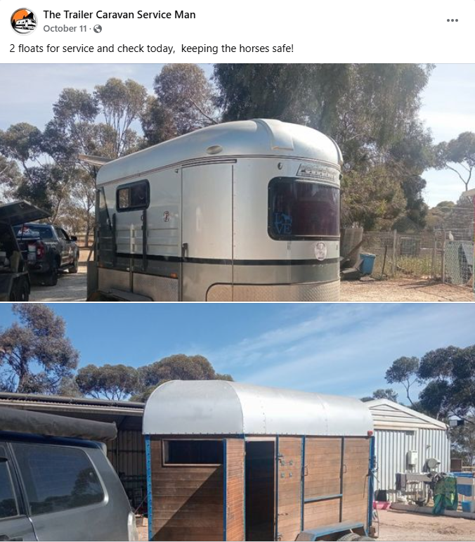 Two horse float trailers being serviced outdoors.