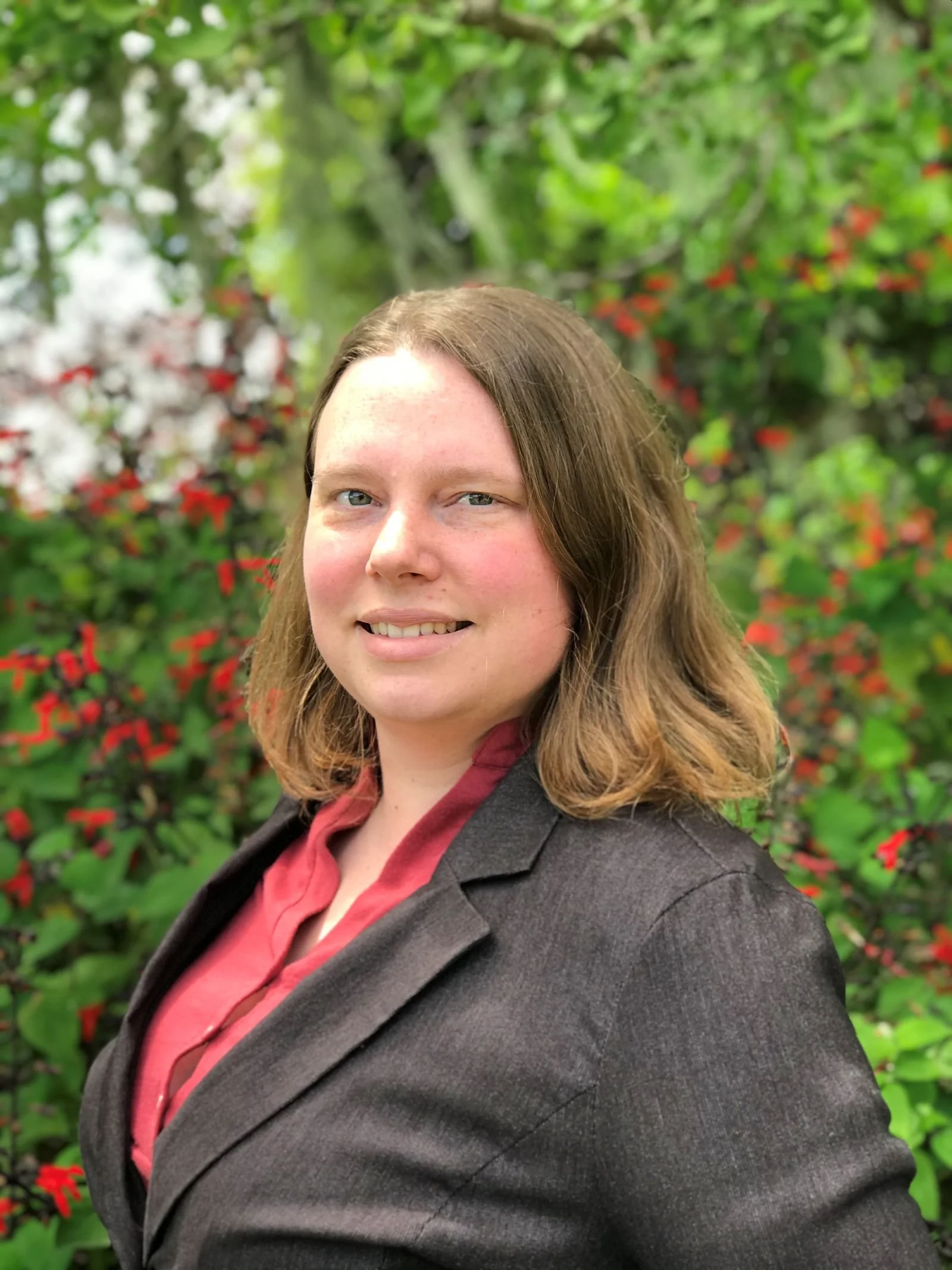 Jessica Brohmer, LMFT grief and anxiety therapist wearing a blazer (so professional!)