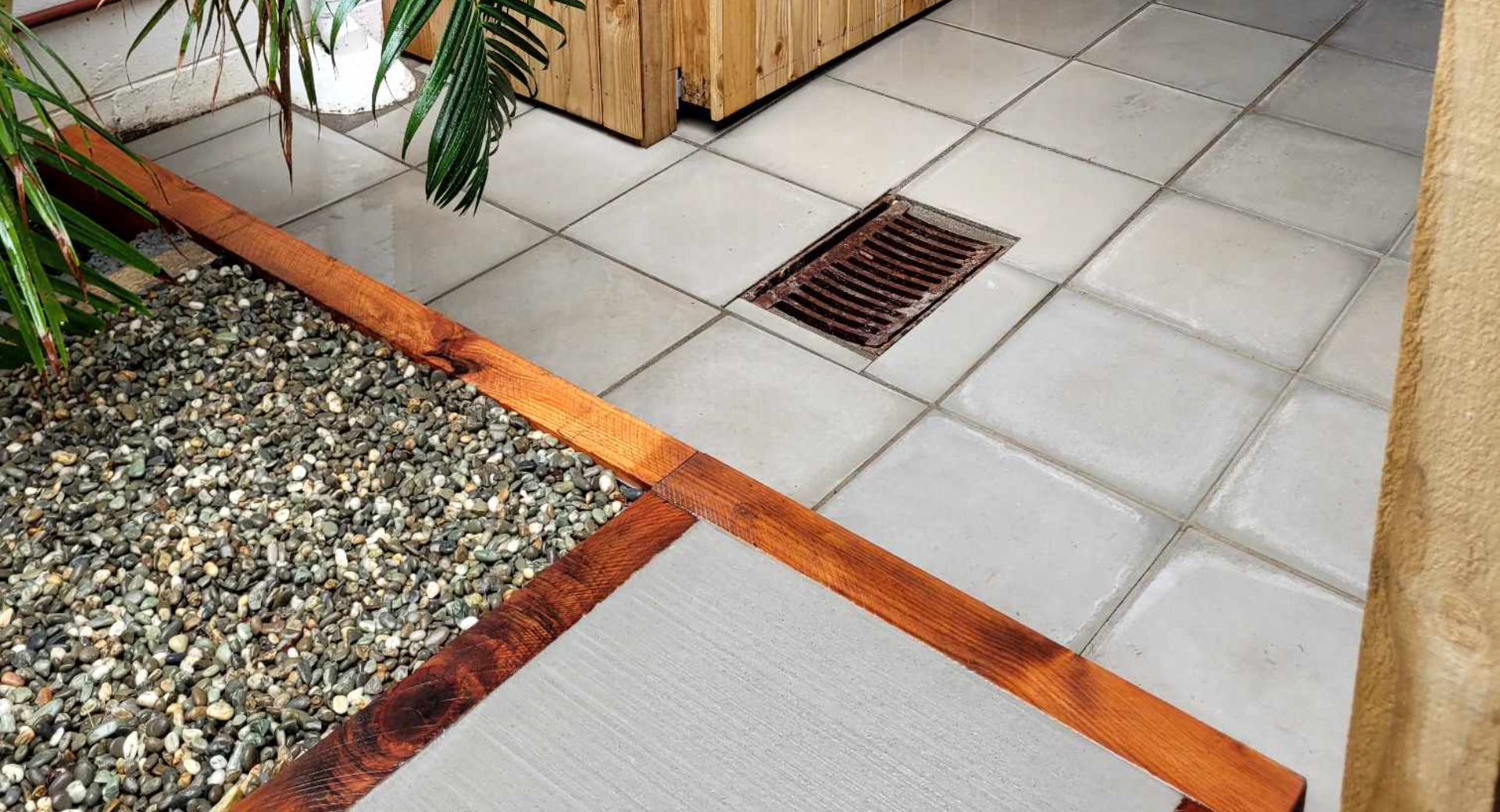 Paved patio with macrocarpa framed steps