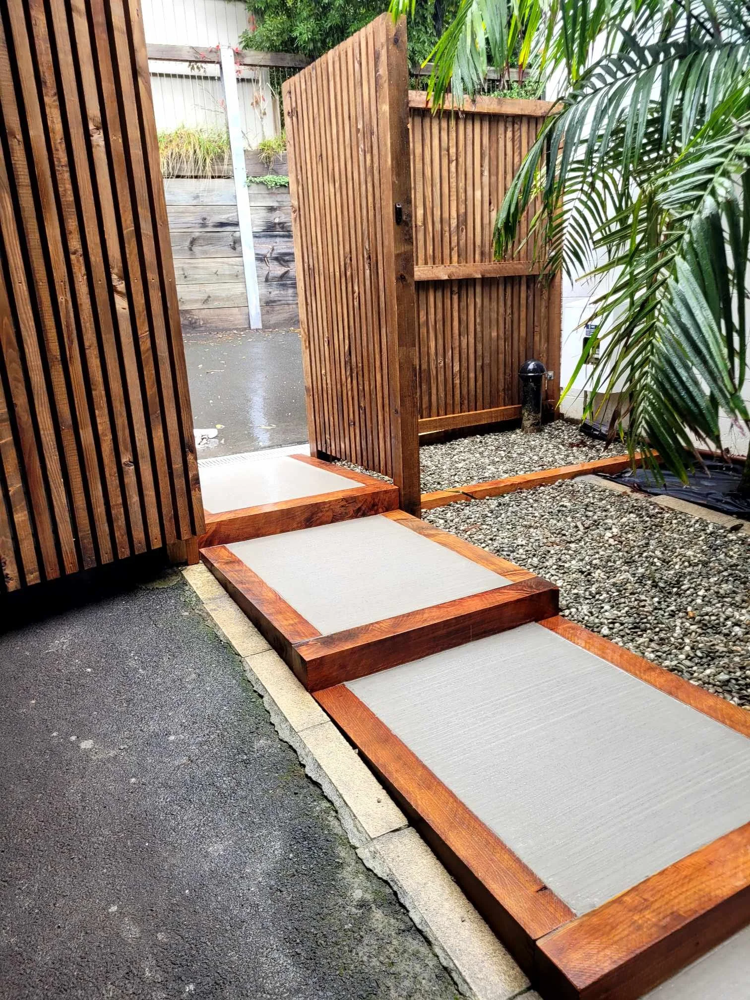 Cedar fencing and macrocarpa framed steps