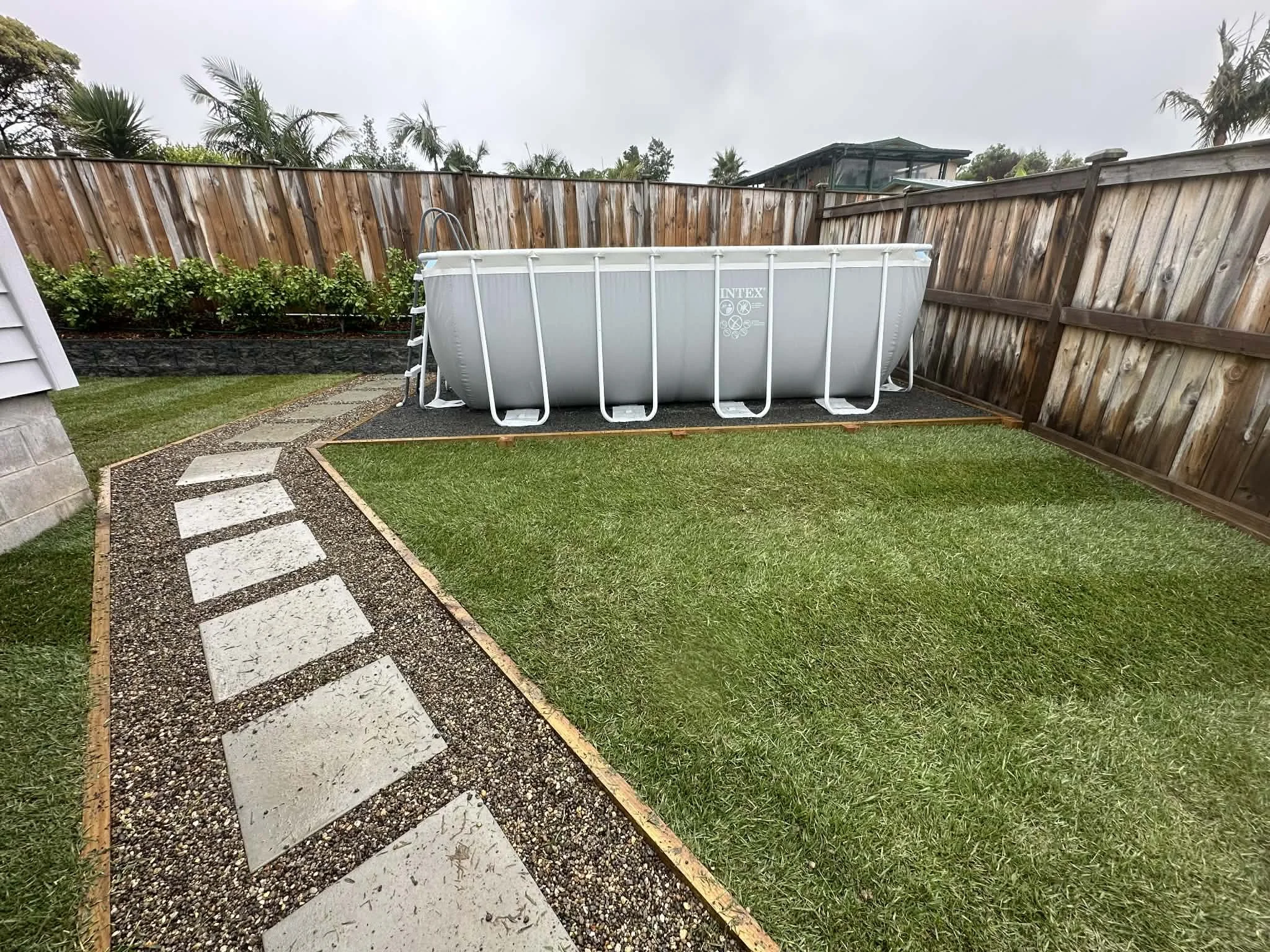 new ready lawn, with paver pathway and base for pool