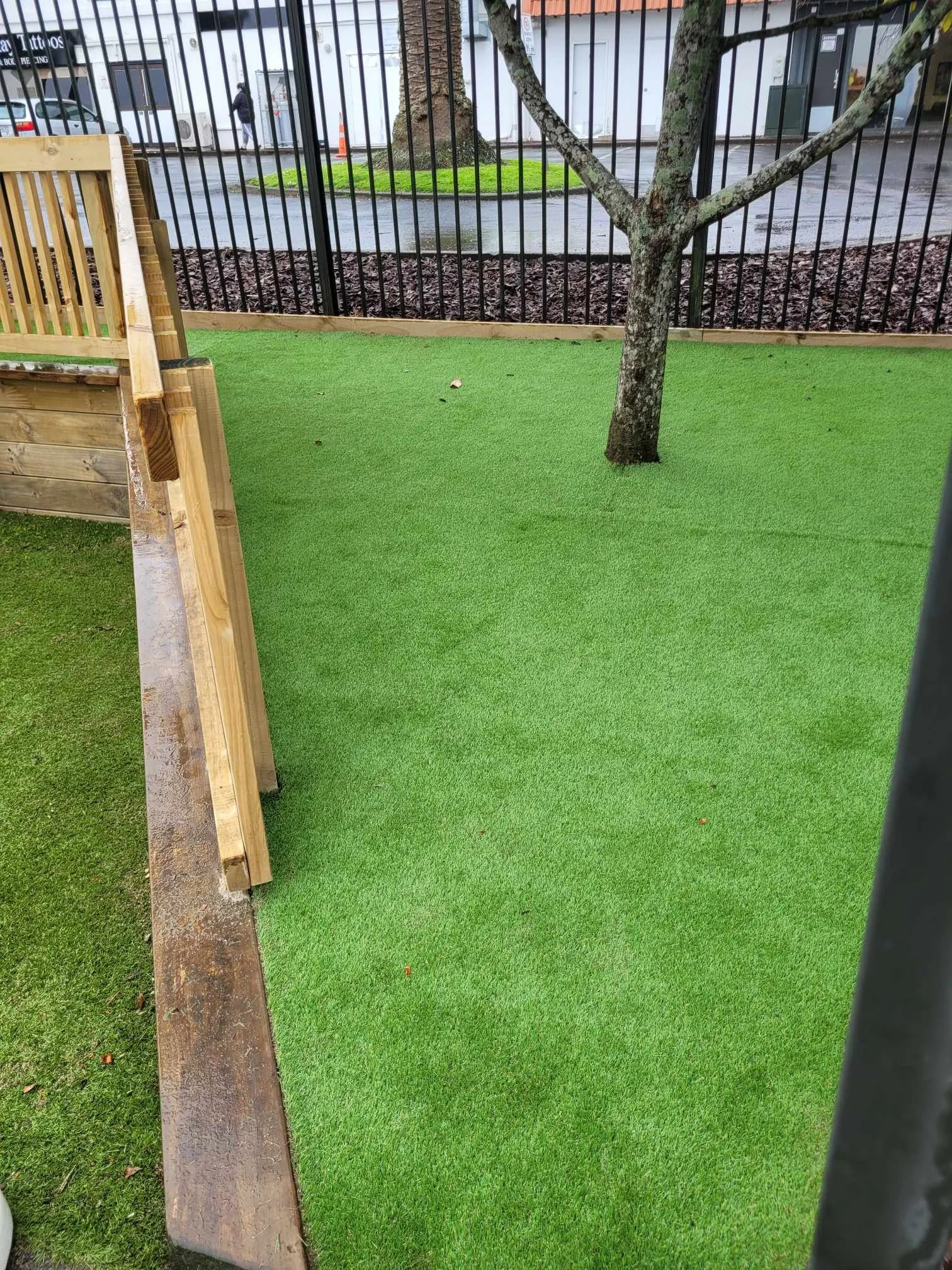 Artificial turf installation around tree