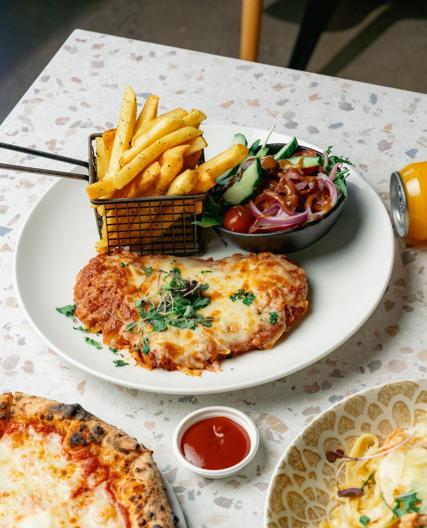 If you were looking for a reason to head out today, let this be it. $18 chicken parma with chips and mixed salad, available all day from 12pm.