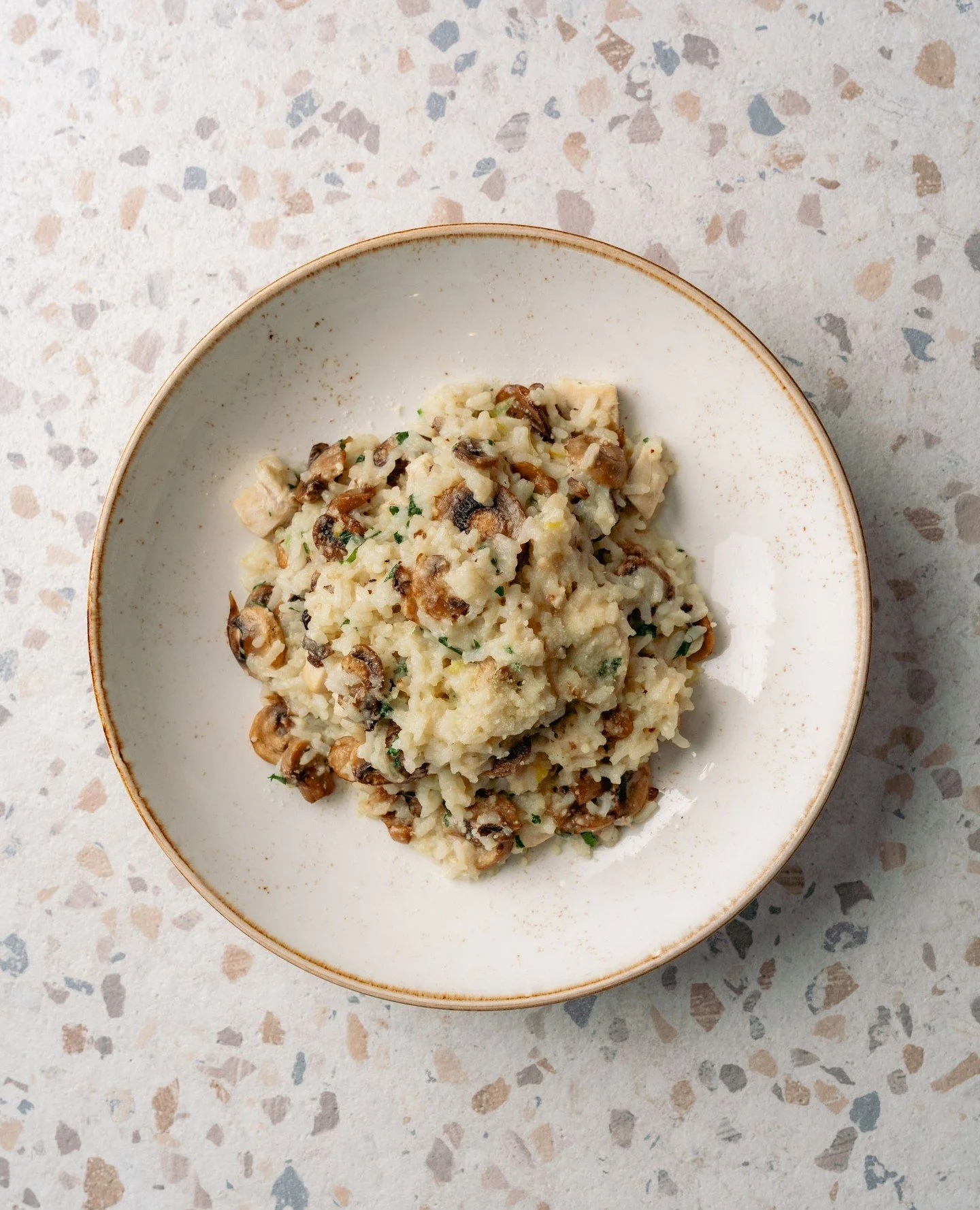 The kind of dish you start to crave as the cooler days settle in. Chicken and mushroom risotto with arborio rice, mushrooms, garlic and parmesan.