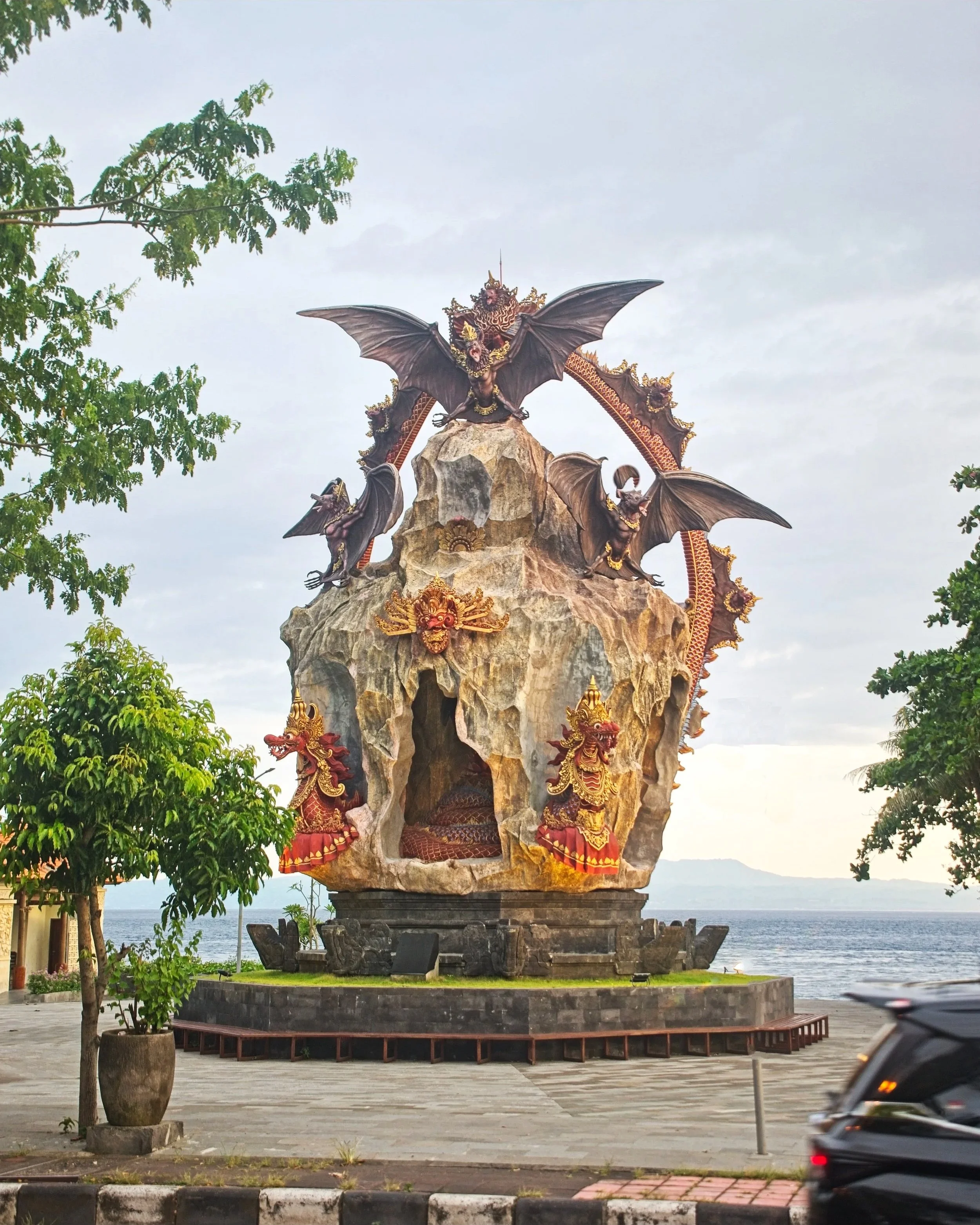 Statue on the coast road outside the temple.