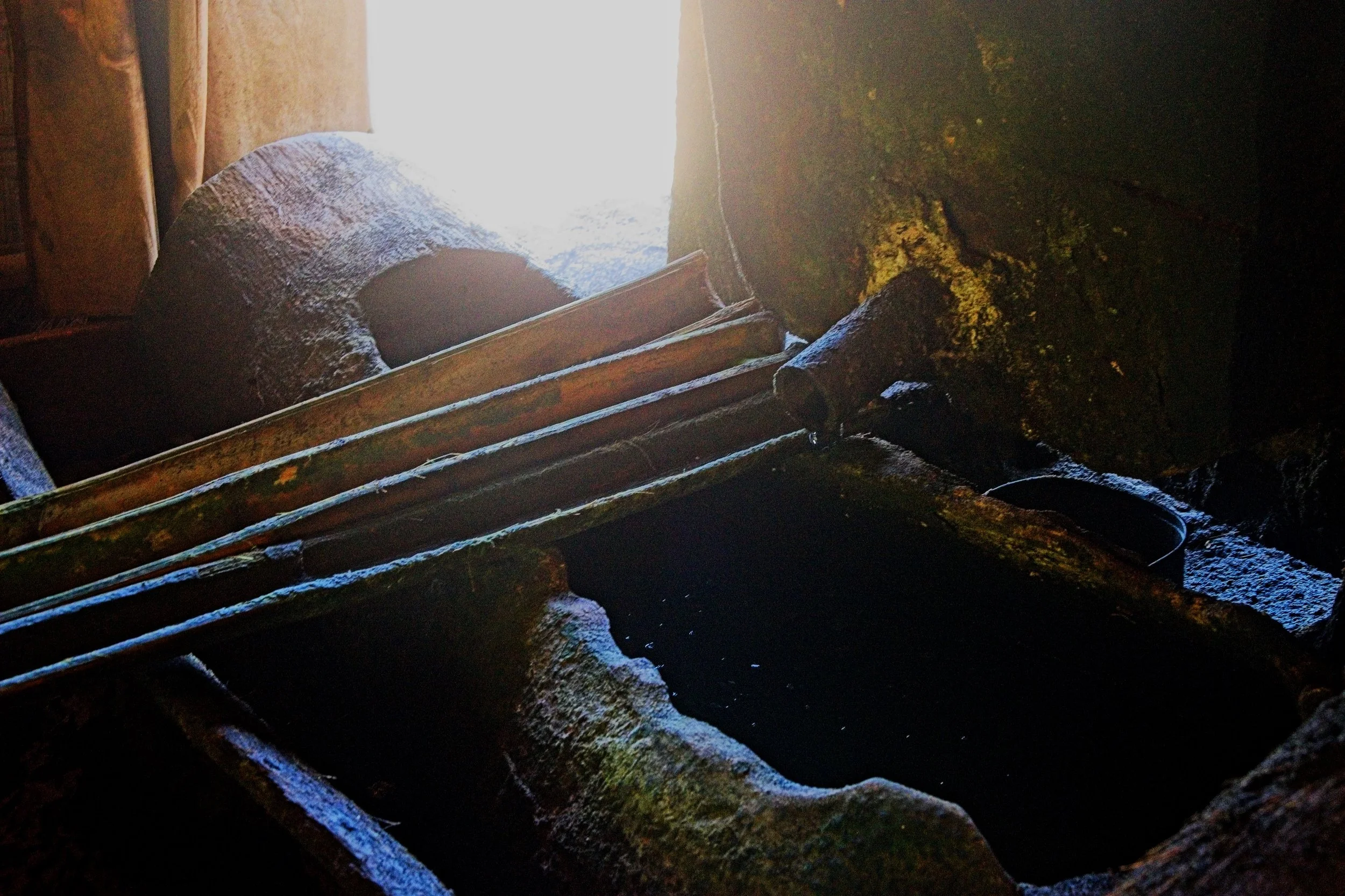 The salty water filters through the salty sand and collects in a brine trough.