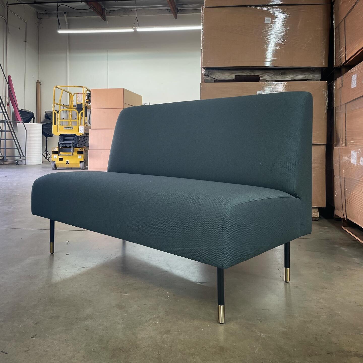 The versatile Rally banquette is standing by to make group seating, dining, and working a breeze. Here, shown with a simple tight back, our standard brushed brass sabots, and customer&rsquo;s own material for upholstery. #workplacedesign #customfurni