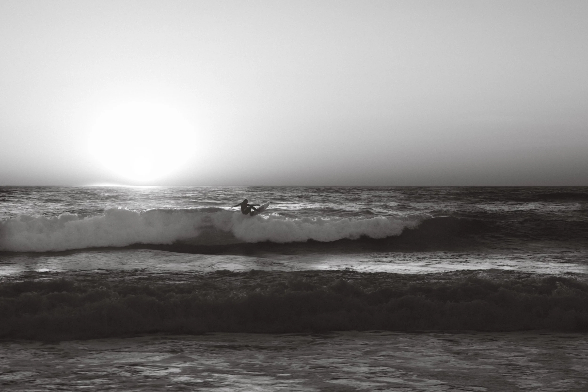 surfer catching the waves in portugal