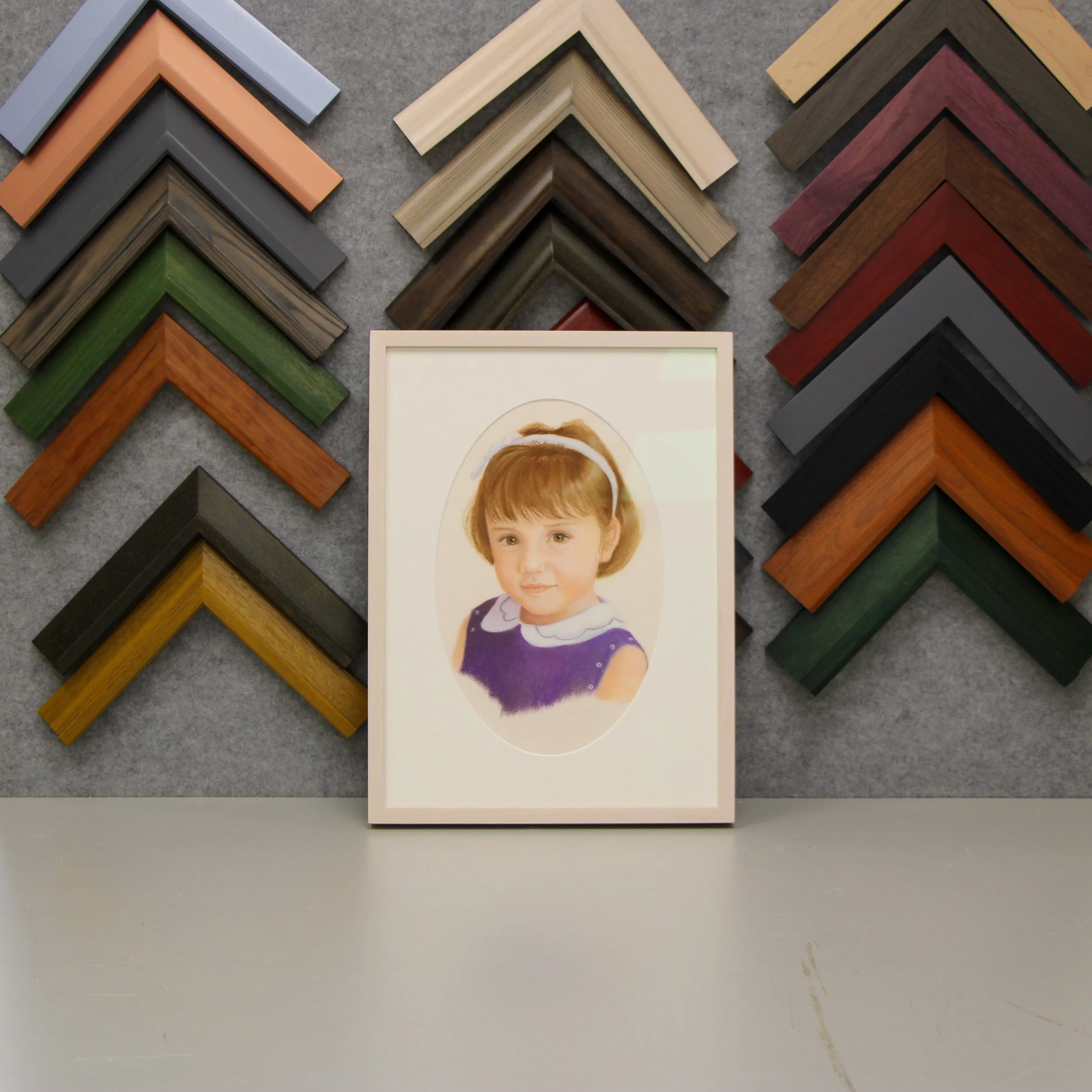 I colored pencil portrait of a young girl and a simple white frame.