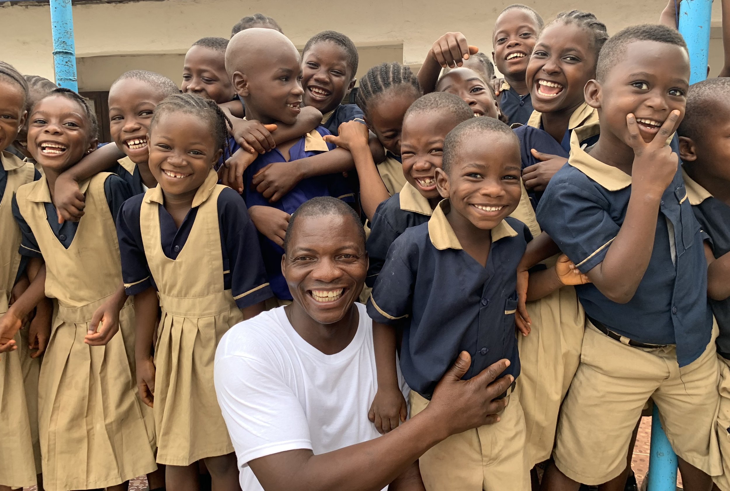 Eric W. Wowoh with his school children in Liberia