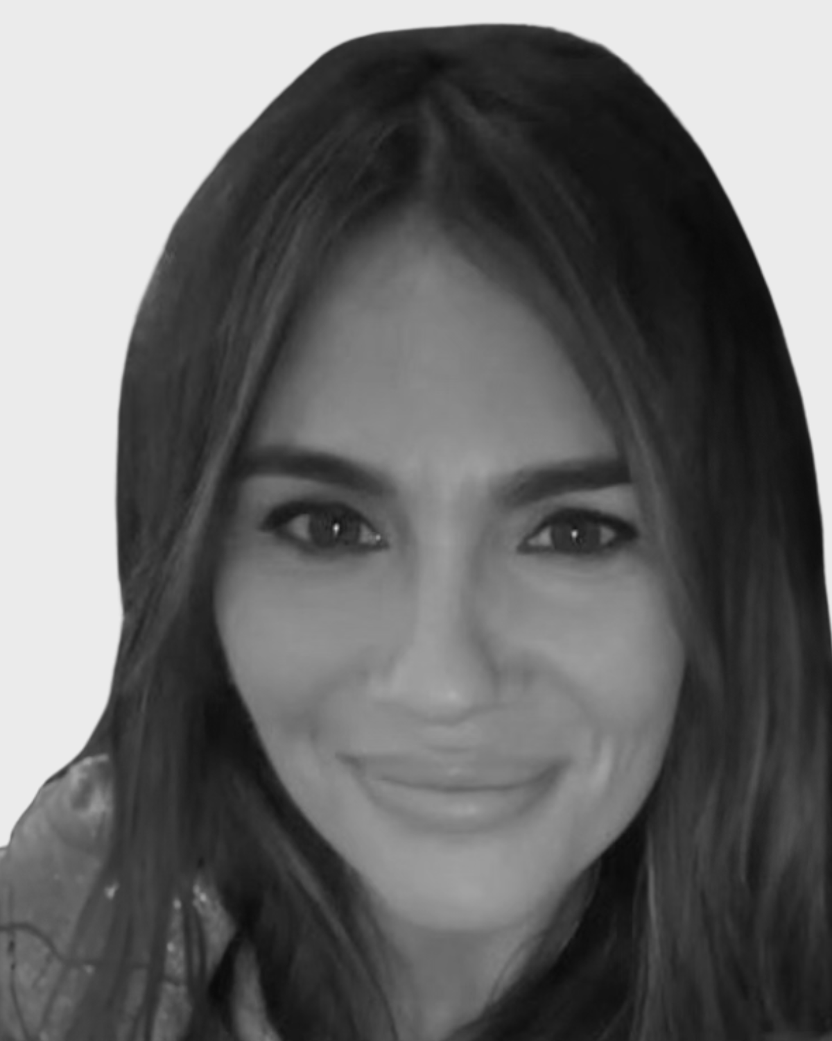 Black and white portrait of a young woman with long, dark hair smiling at the camera.