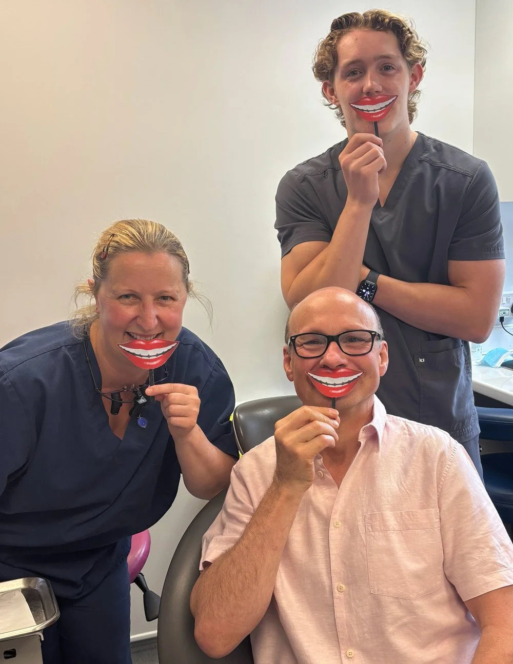 Myth Busting: No pain, no problem? Dentists with patient at Dental Smiles Chelmsford