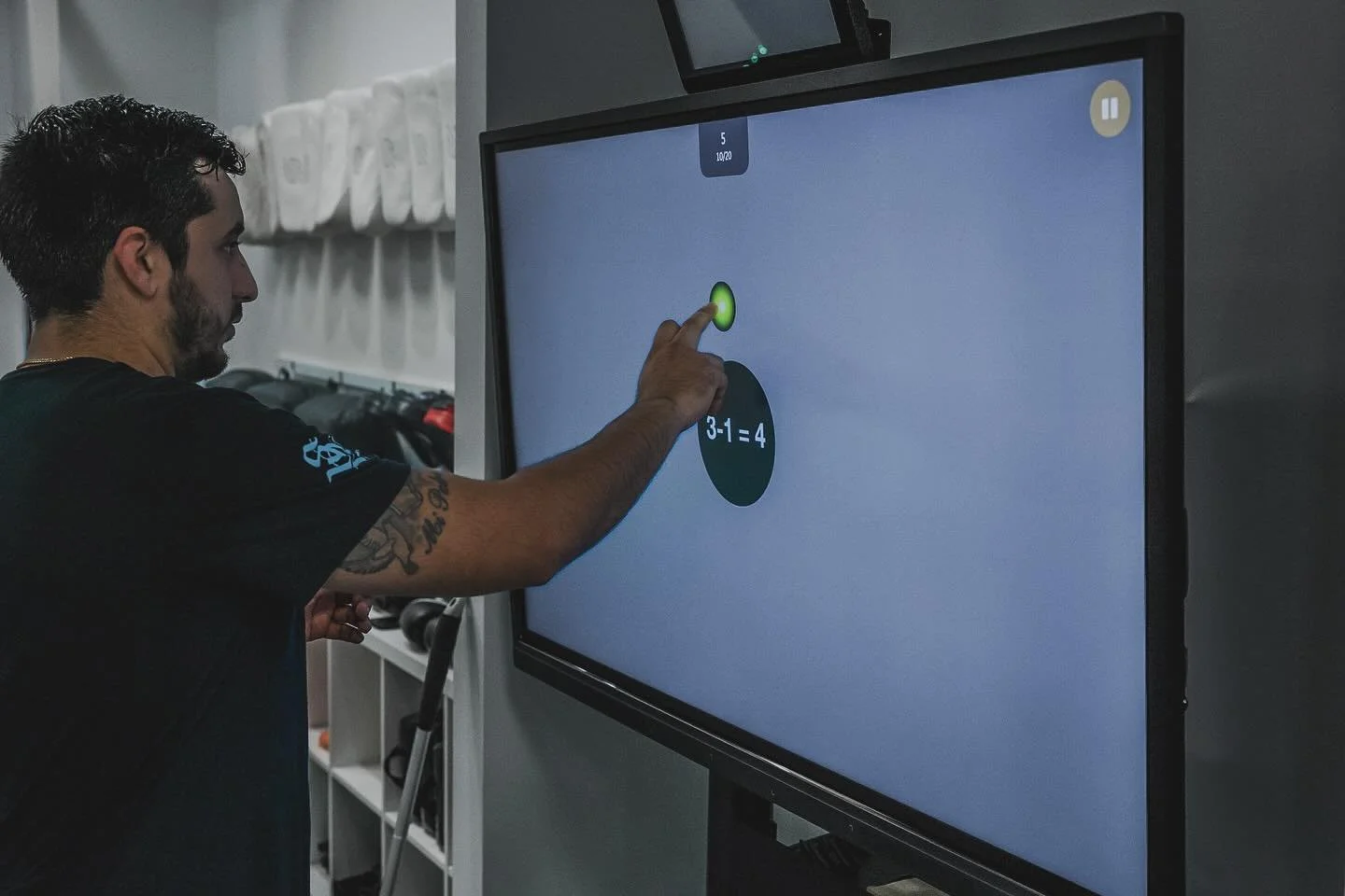 Neuro cognitive training. Here our athlete is figuring out math problems while tapping moving targets. This split attention drill has a multiple benefits in every sport arena. Efficient data processing under pressure is key to success in any sport. C
