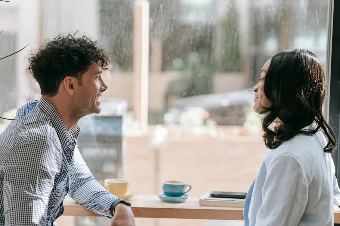 man-and-woman-talking-while-having-coffee