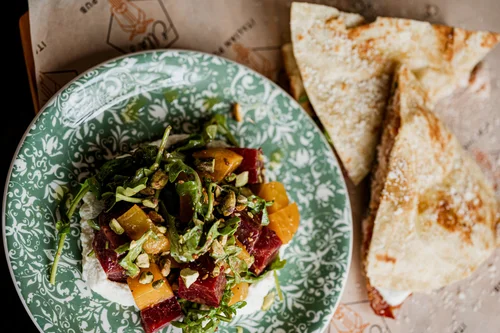 An Italian piadina sandwich and beet salad at Ella’s