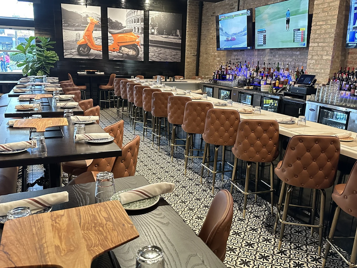 The bar, comfortable seating and televisions at Ella’s Elmhurst