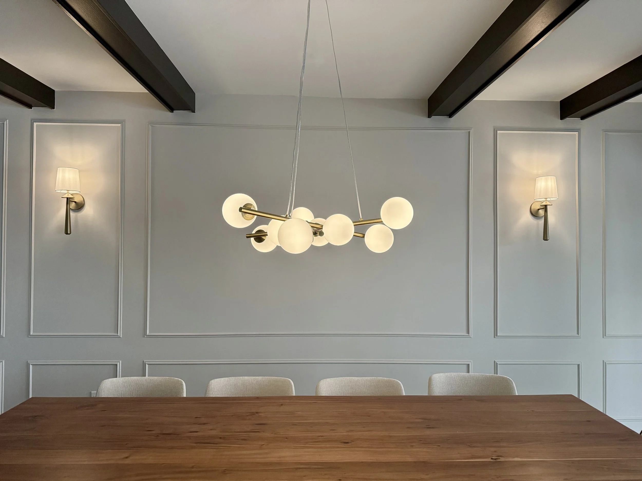 Dining room - panelled wall & clad beams 