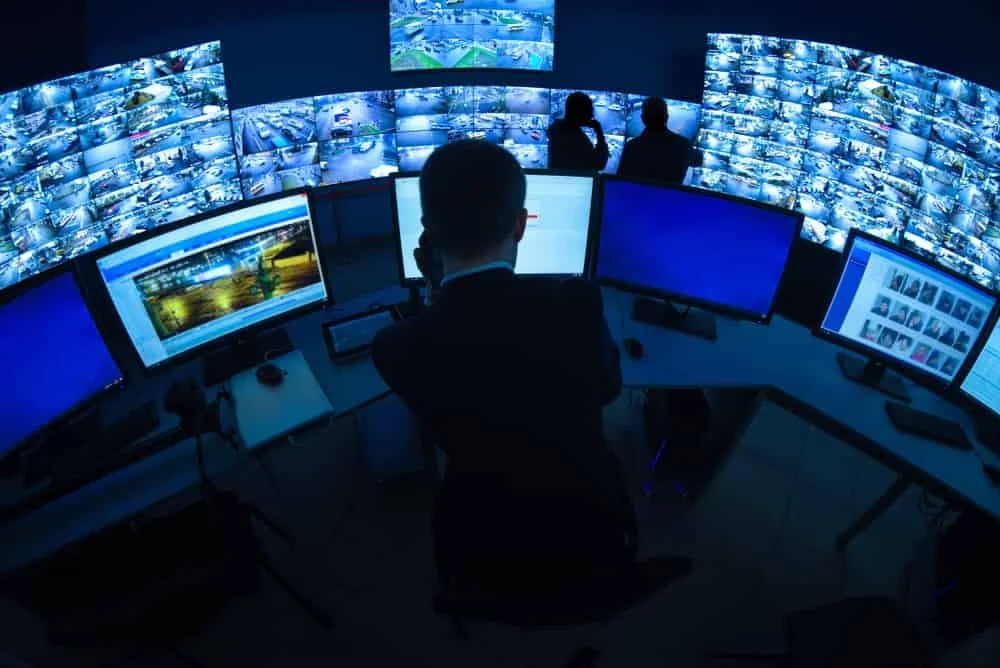 Multiple operators viewing many video surveillance monitors