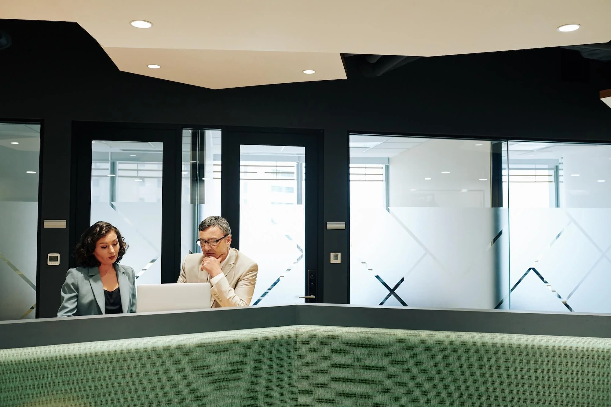 Two business people working in a financial institution.