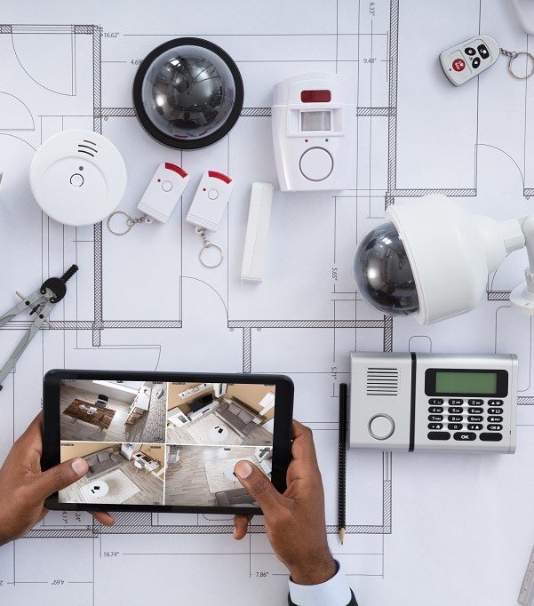 Security devices laying on top of blueprint