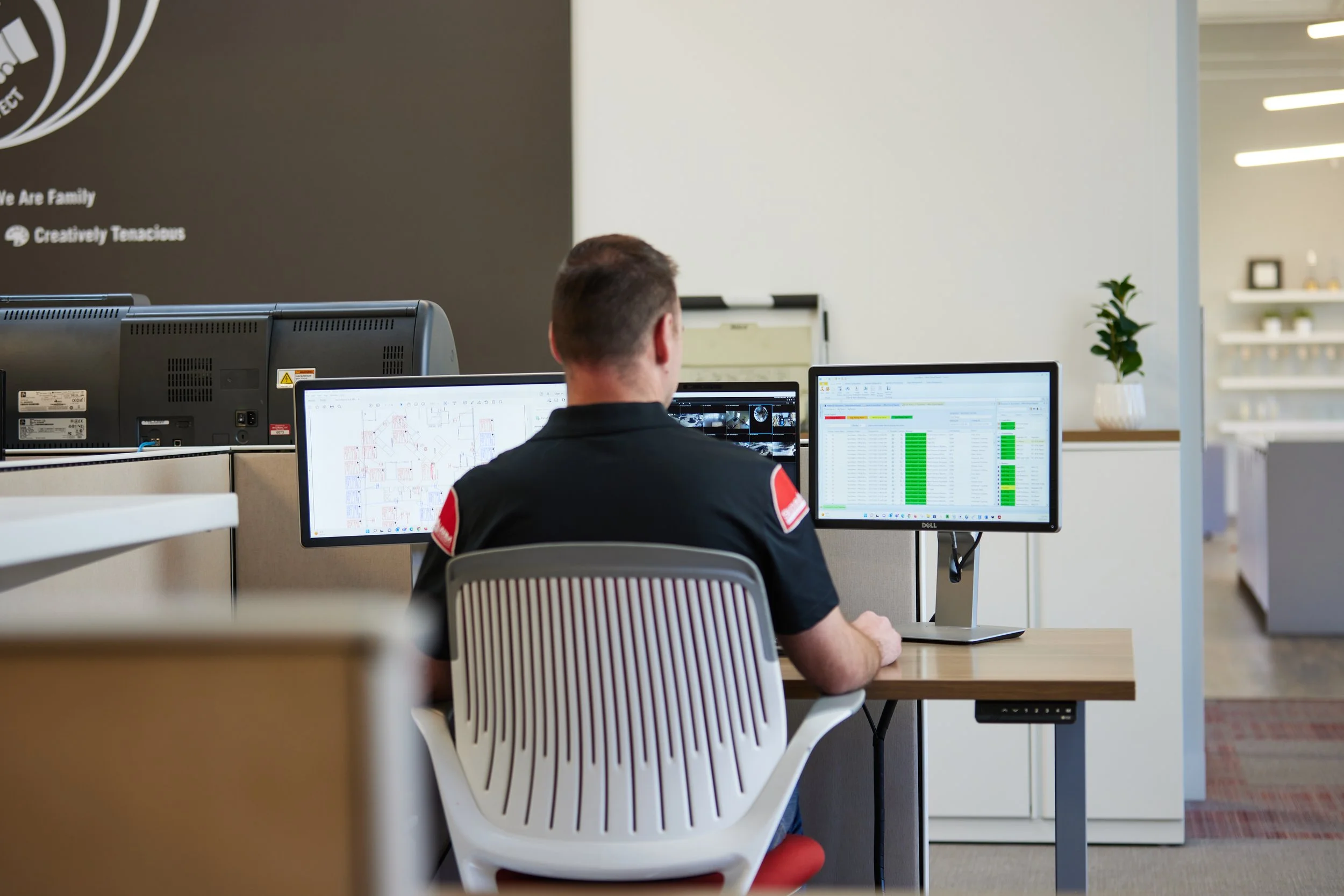 Security guard monitoring airport systems.