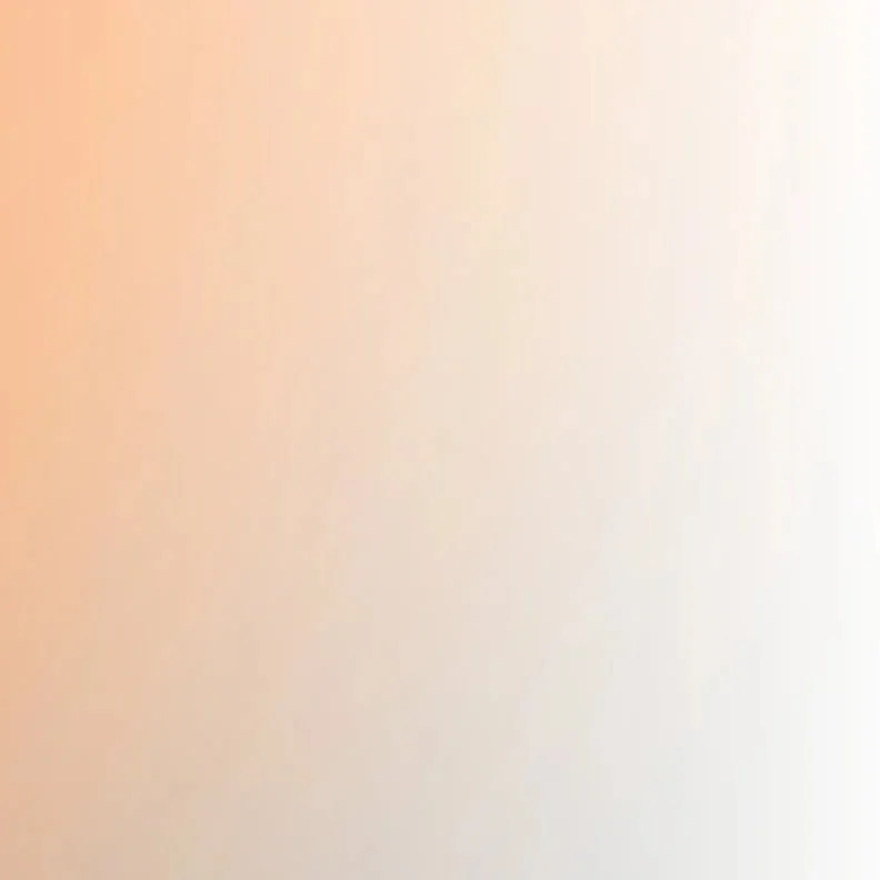 Blurred background with warm tones, no distinct objects or details visible.