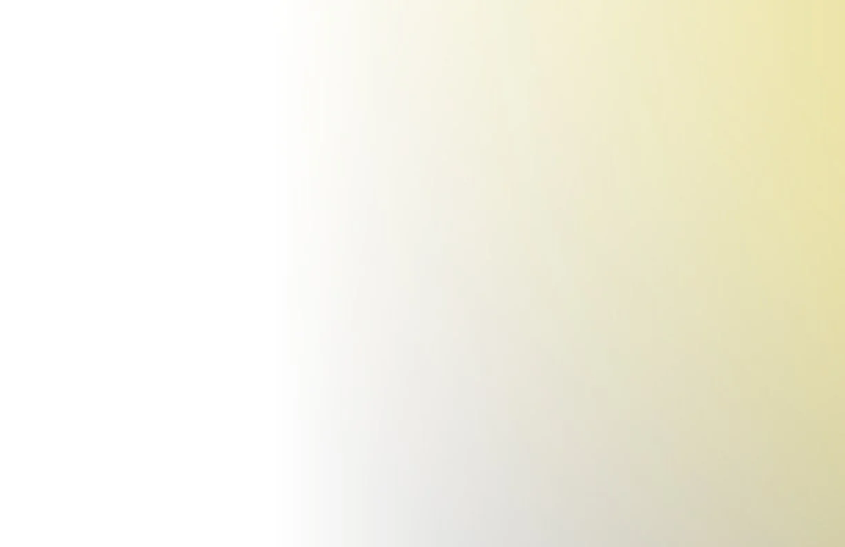 The image shows a light-colored background with a gradient transitioning from white to pale yellow.