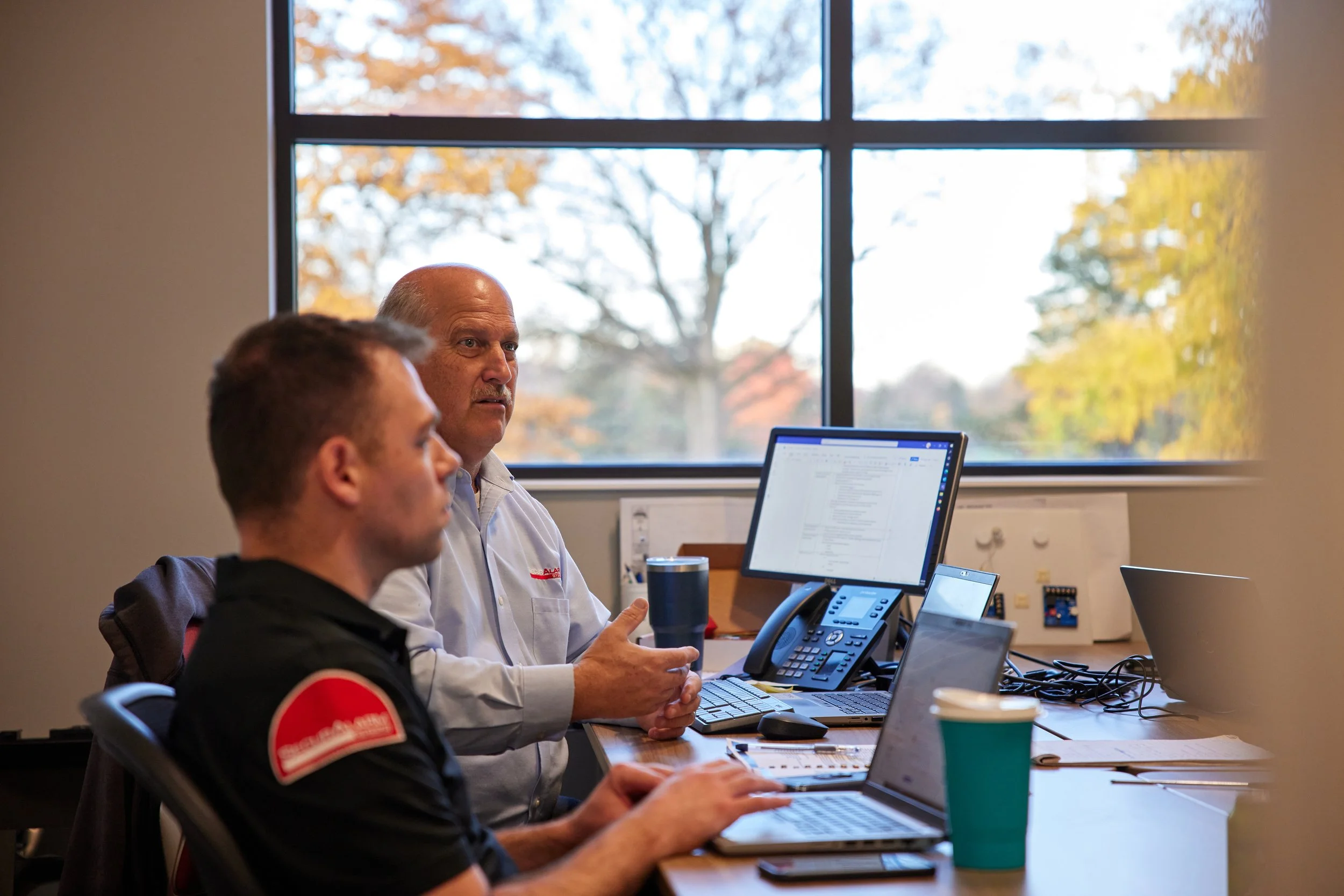 SecurAlarm team in a client meeting.