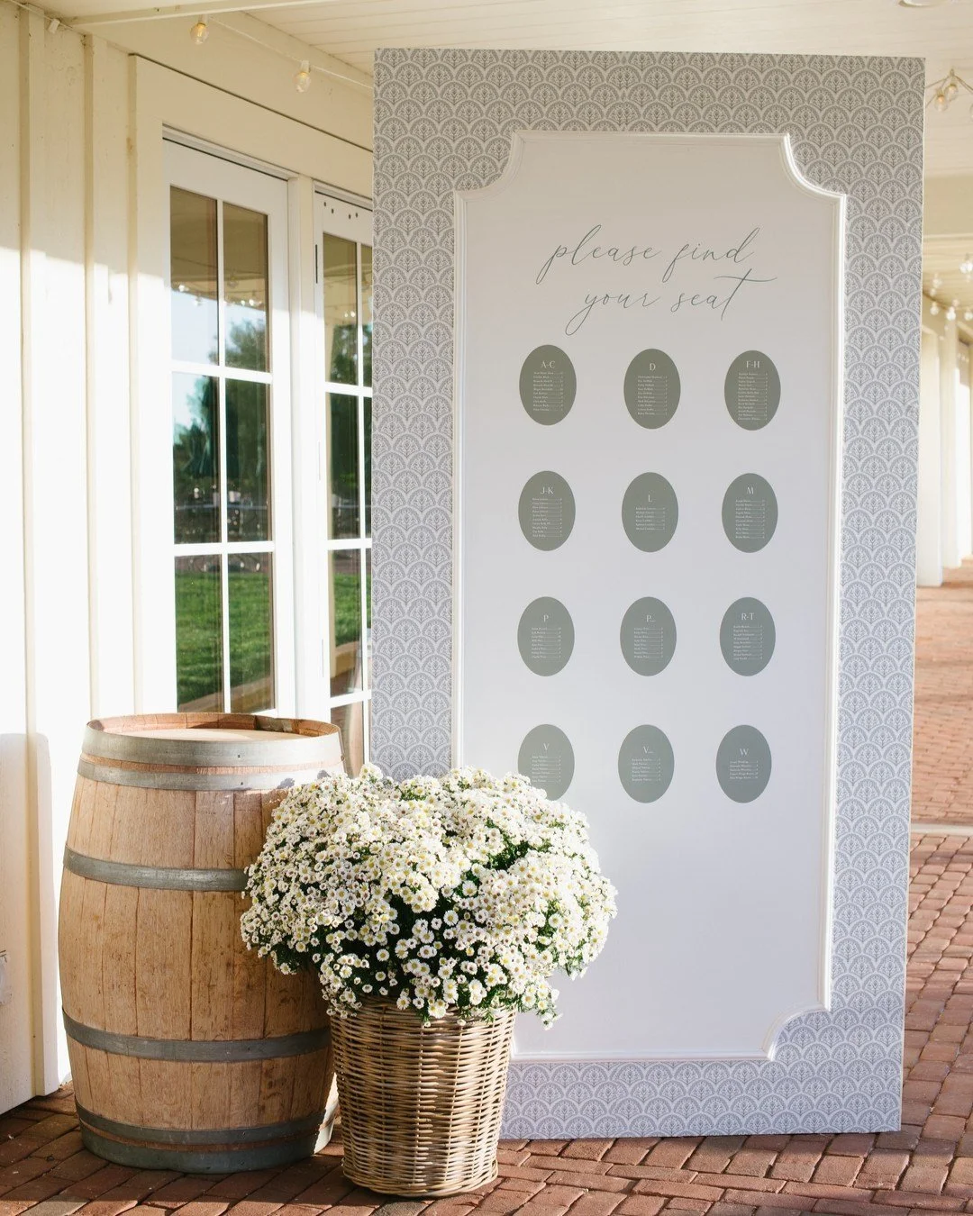 Proof that your paper story doesn&rsquo;t end once the envelopes are opened.

Oval escort cards inspired by the invitation suite, mounted on a custom wall wrapped in the same pattern as the envelope liners&mdash;because continuity is the luxury detai