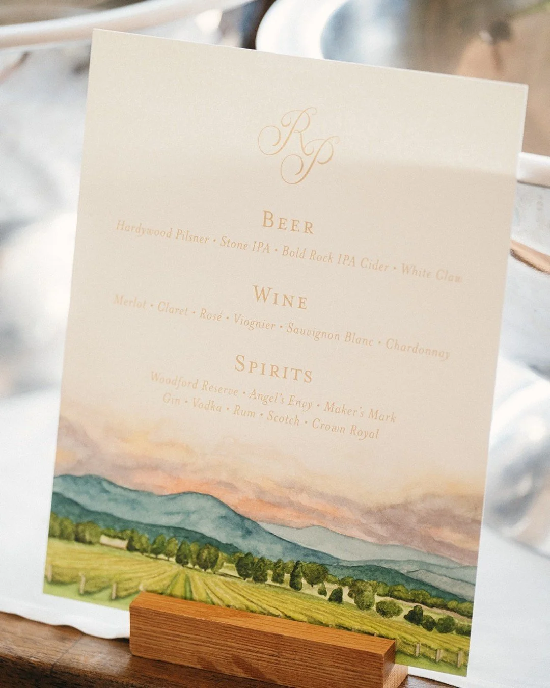 A toast to the vines that inspired it all. 🍷

Created for a celebration at Veritas Vineyards, this custom bar menu features a hand-painted watercolor of the rolling vineyard landscape&mdash;bringing the setting straight onto the paper. From wine sel