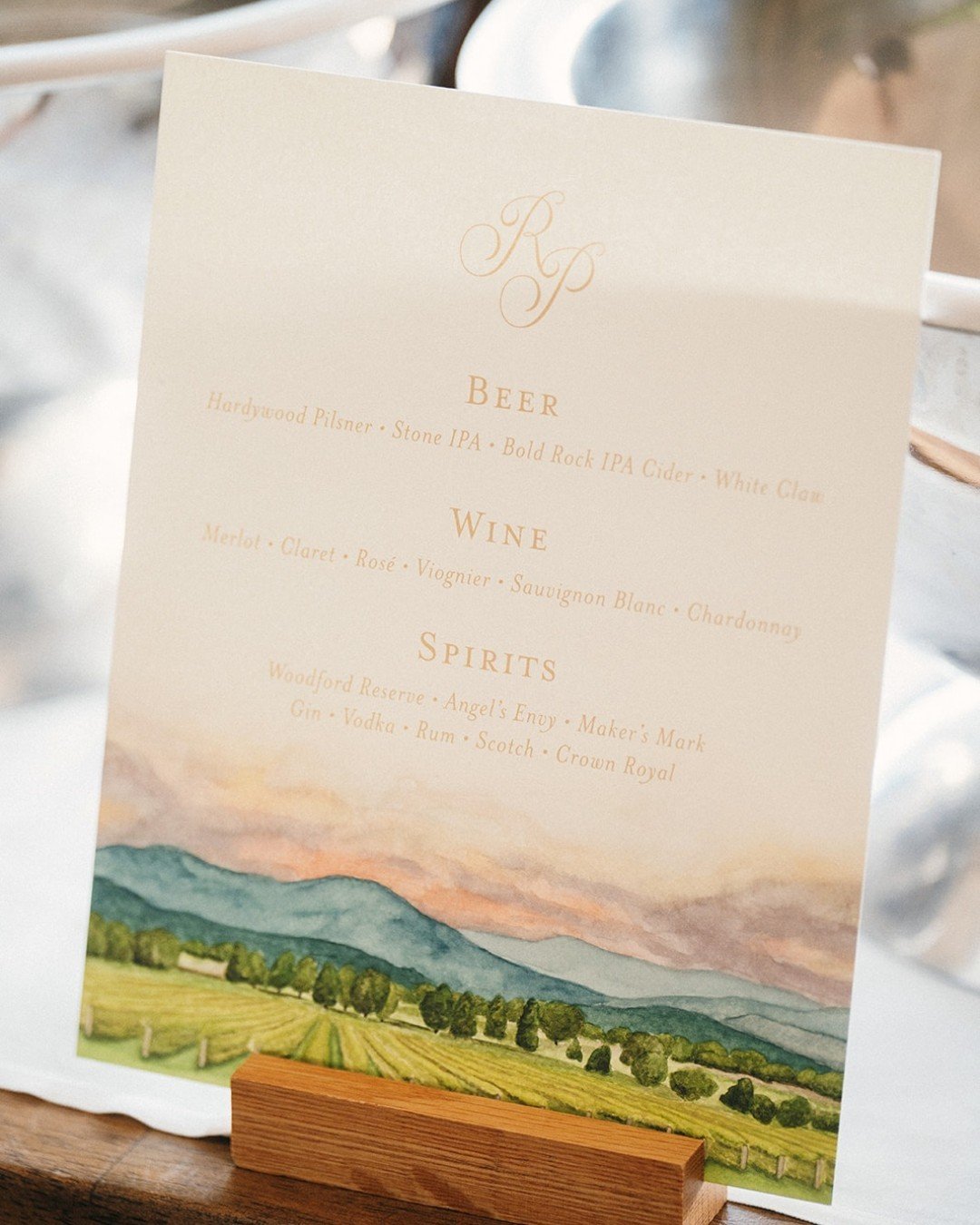 A toast to the vines that inspired it all. 🍷

Created for a celebration at Veritas Vineyards, this custom bar menu features a hand-painted watercolor of the rolling vineyard landscape&mdash;bringing the setting straight onto the paper. From wine sel
