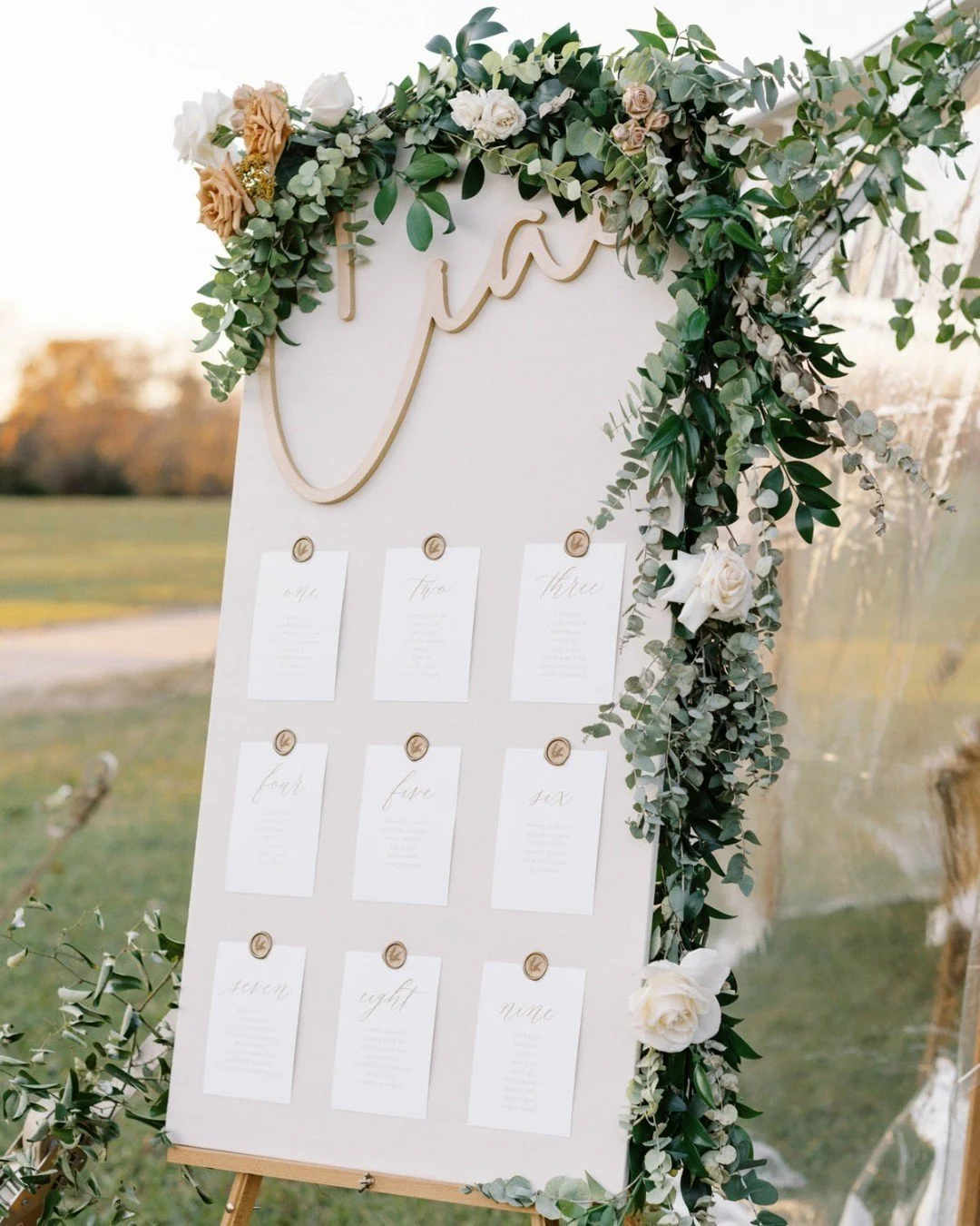 One of my favorite ways to welcome guests into the reception space: a beautifully designed seating display.

Rather than individual escort cards, this couple opted for a large seating chart that guided guests to their tables in a way that also double